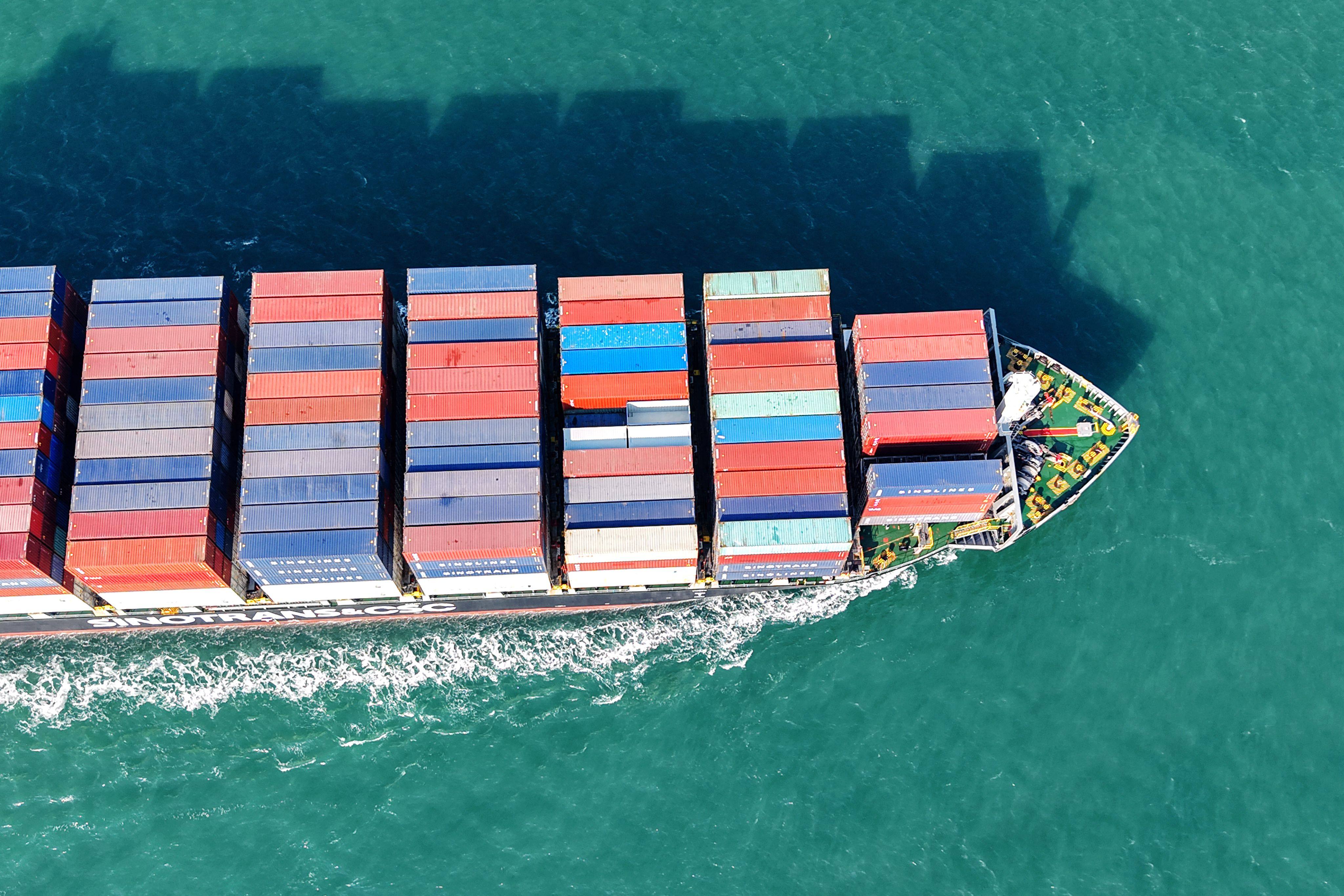 A cargo ship loaded with containers sails out of Qingdao Port in east China’s Shandong province. Photo: AFP