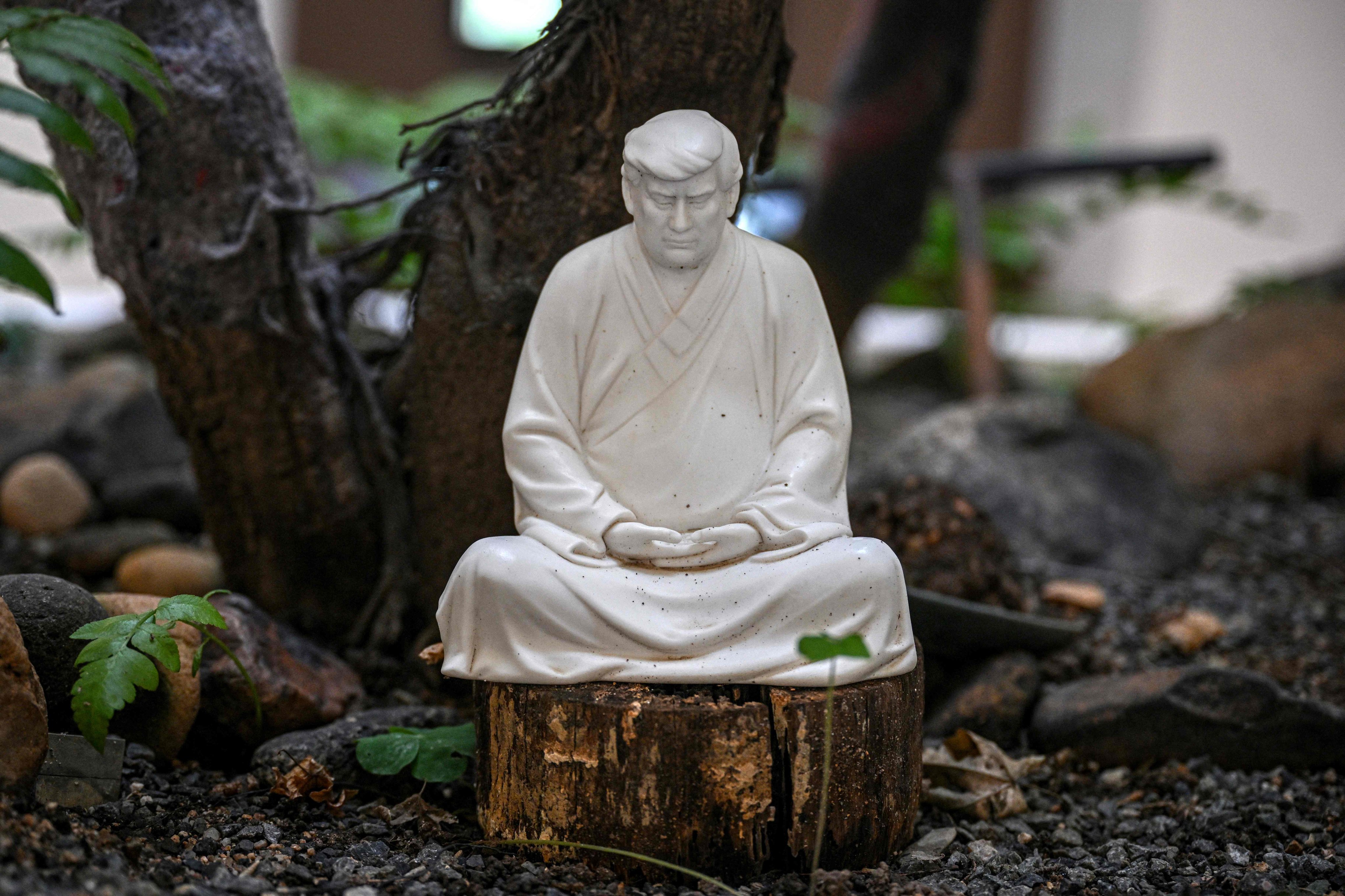 A sculpture of US president-elect Donald Trump in a pose evoking the Buddha. Photo: AFP