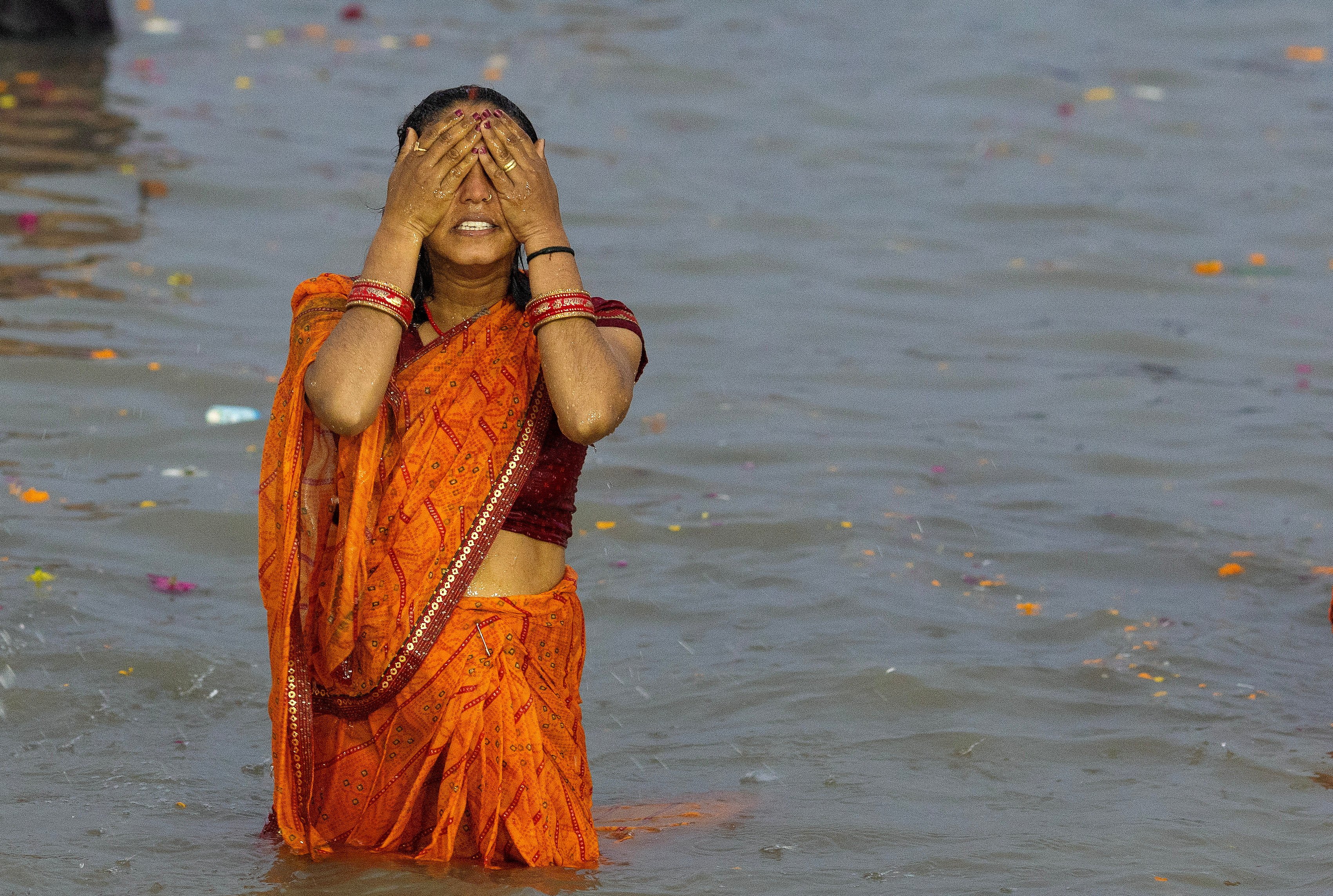 A Hindu devotee takes a holy dip at Sangam, the confluence of the Ganges and Yamuna rivers with the mythical, invisible Saraswati river, at the start of the Maha Kumbh Mela in Prayagraj, India. Photo: Retuters