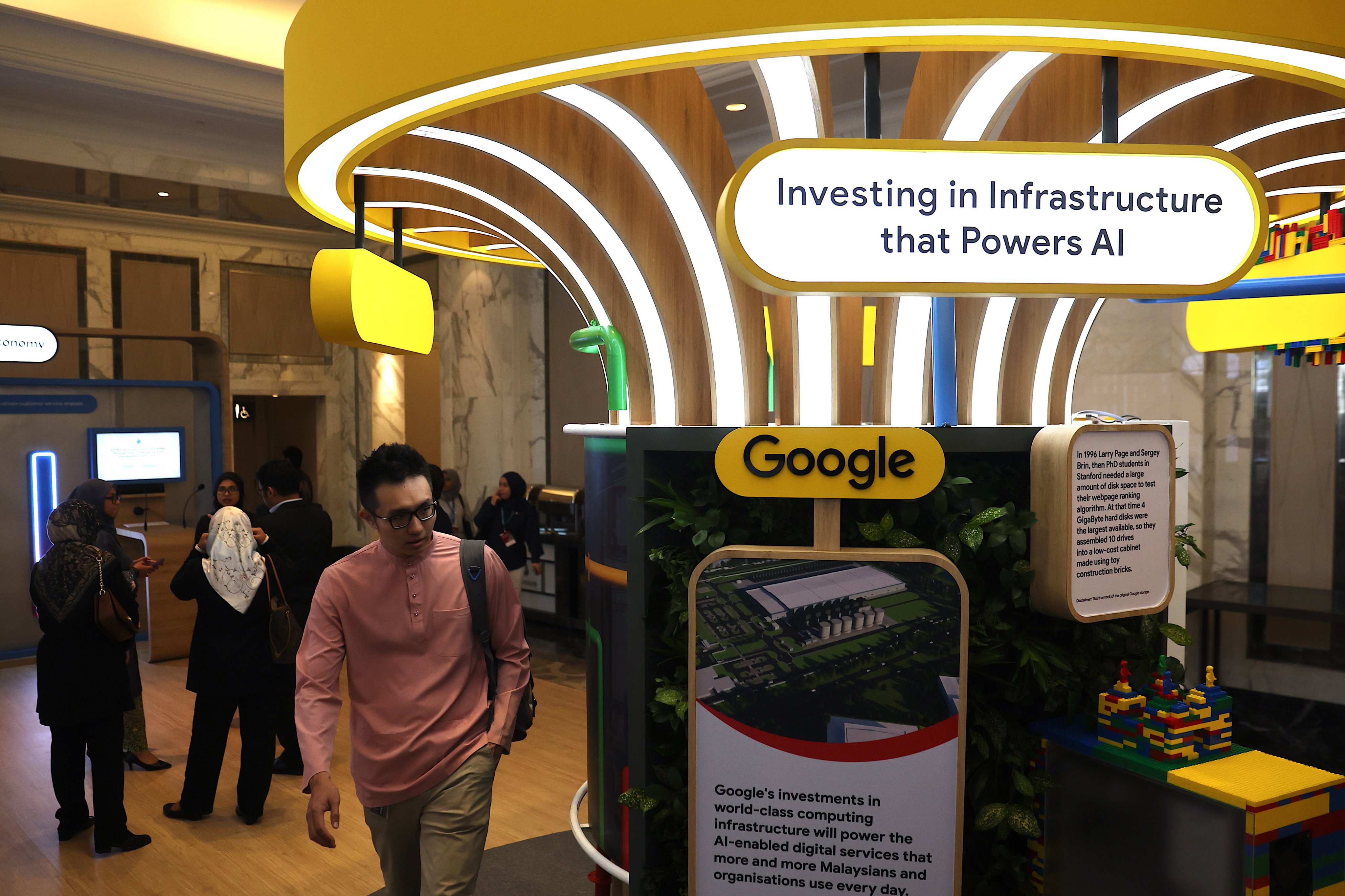 Visitors pass a presentation made by Google during the groundbreaking ceremony for Malaysia’s first Google data centre in Kuala Lumpur on October 1, 2024. Photo: EPA-EFE