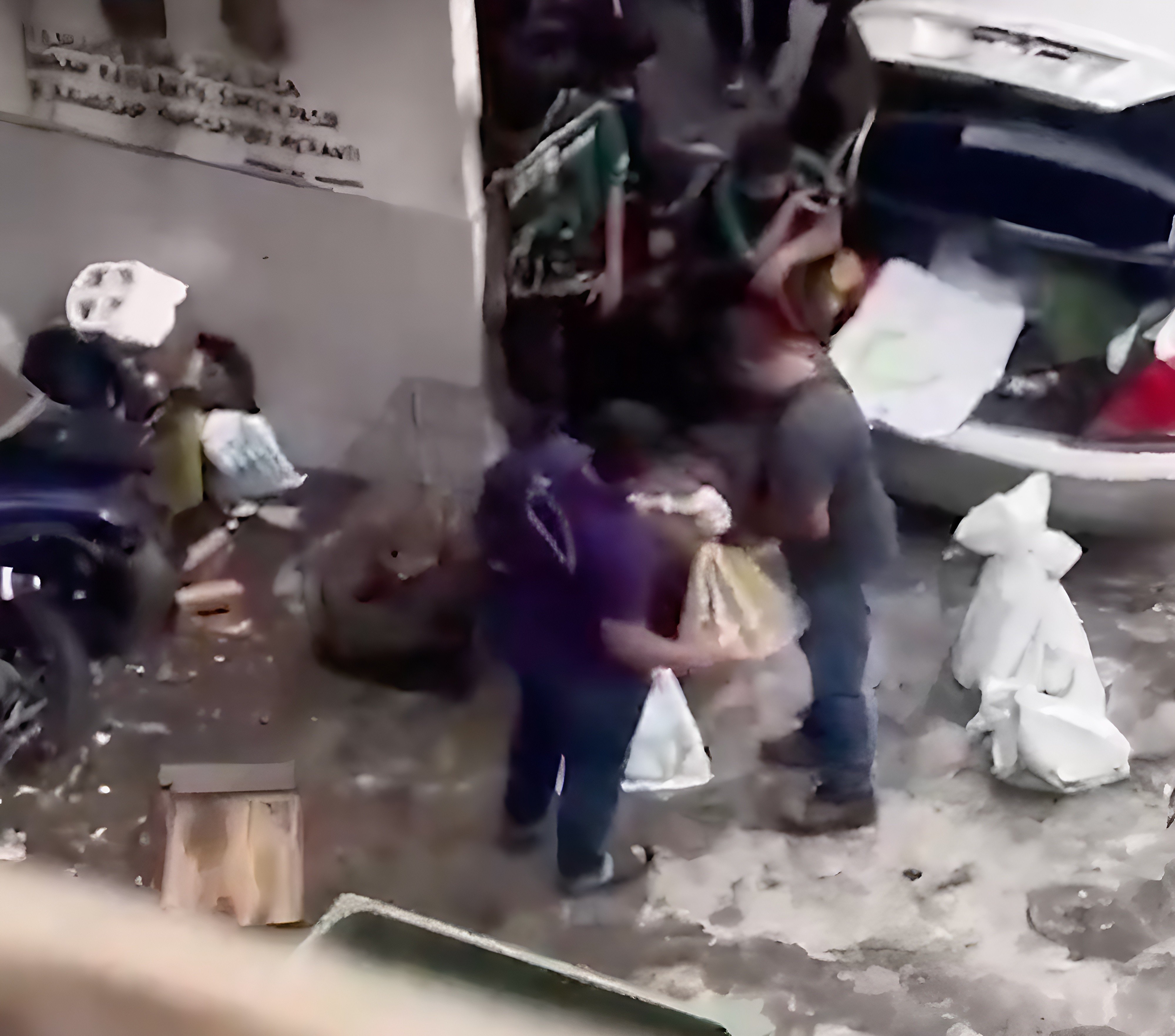 A still from the viral video shows men throwing cat-filled sacks into a waiting vehicle. Photo: X / StarOnline