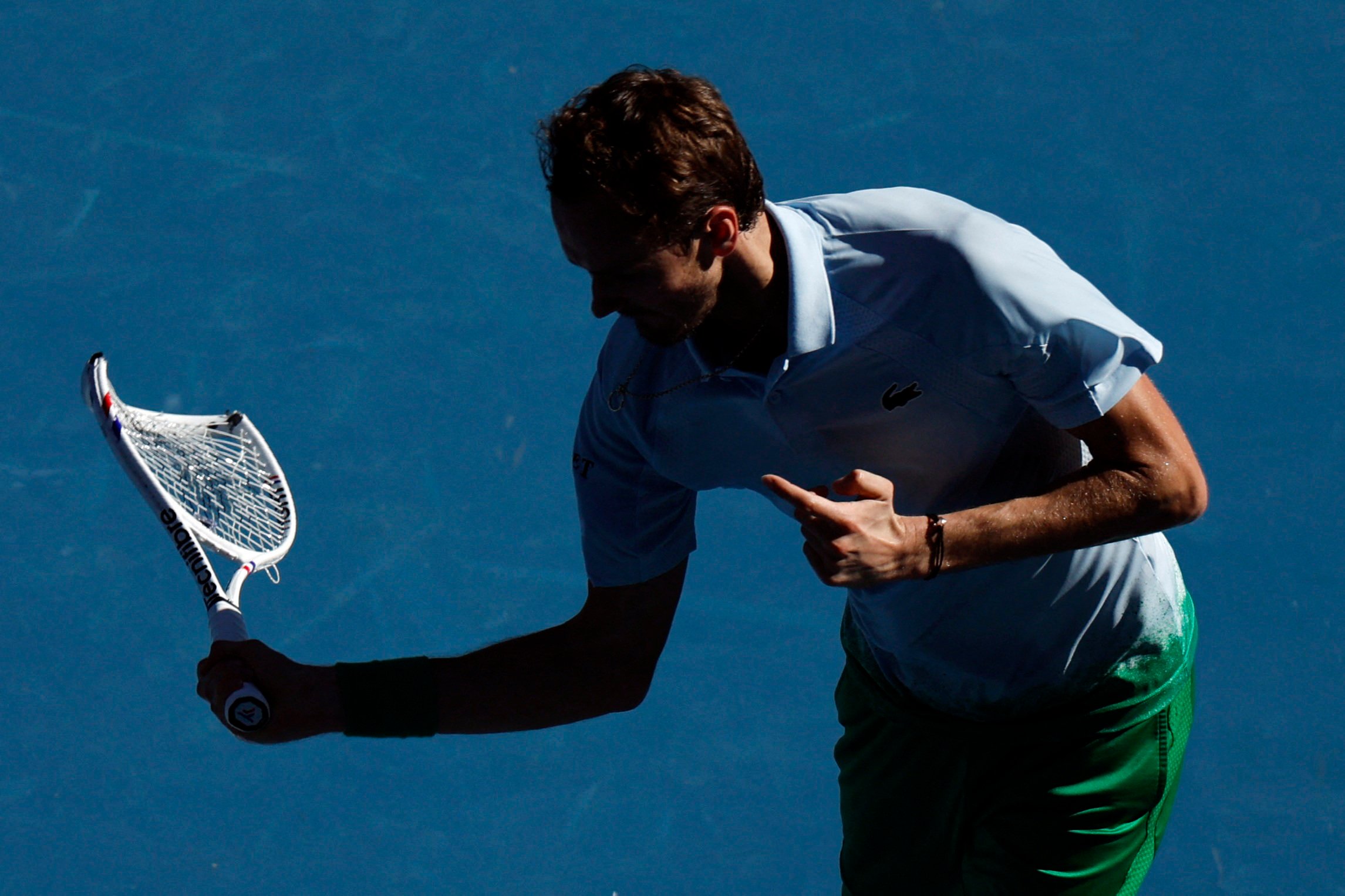 Russia’s Daniil Medvedev smashes his racquet and a net camera during his match against Thailand’s Kasidit Samrej. Photo: Reuters