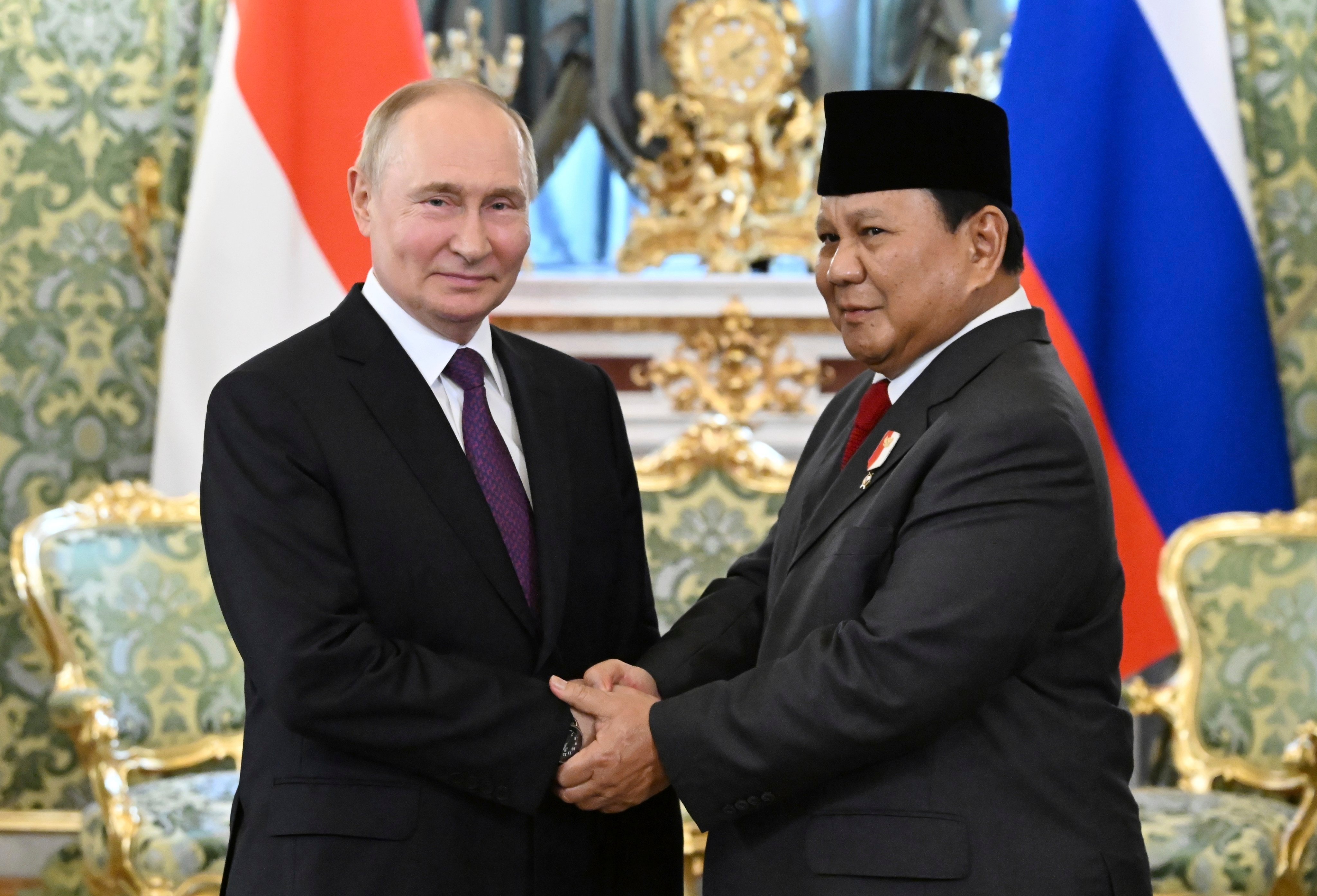 Russian President Vladimir Putin, left, shakes hands with Prabowo Subianto, then Indonesia’s Defence Minister and president-elect, during their meeting at the Kremlin in Moscow, Russia, on July 31, 2024. Photo: AP