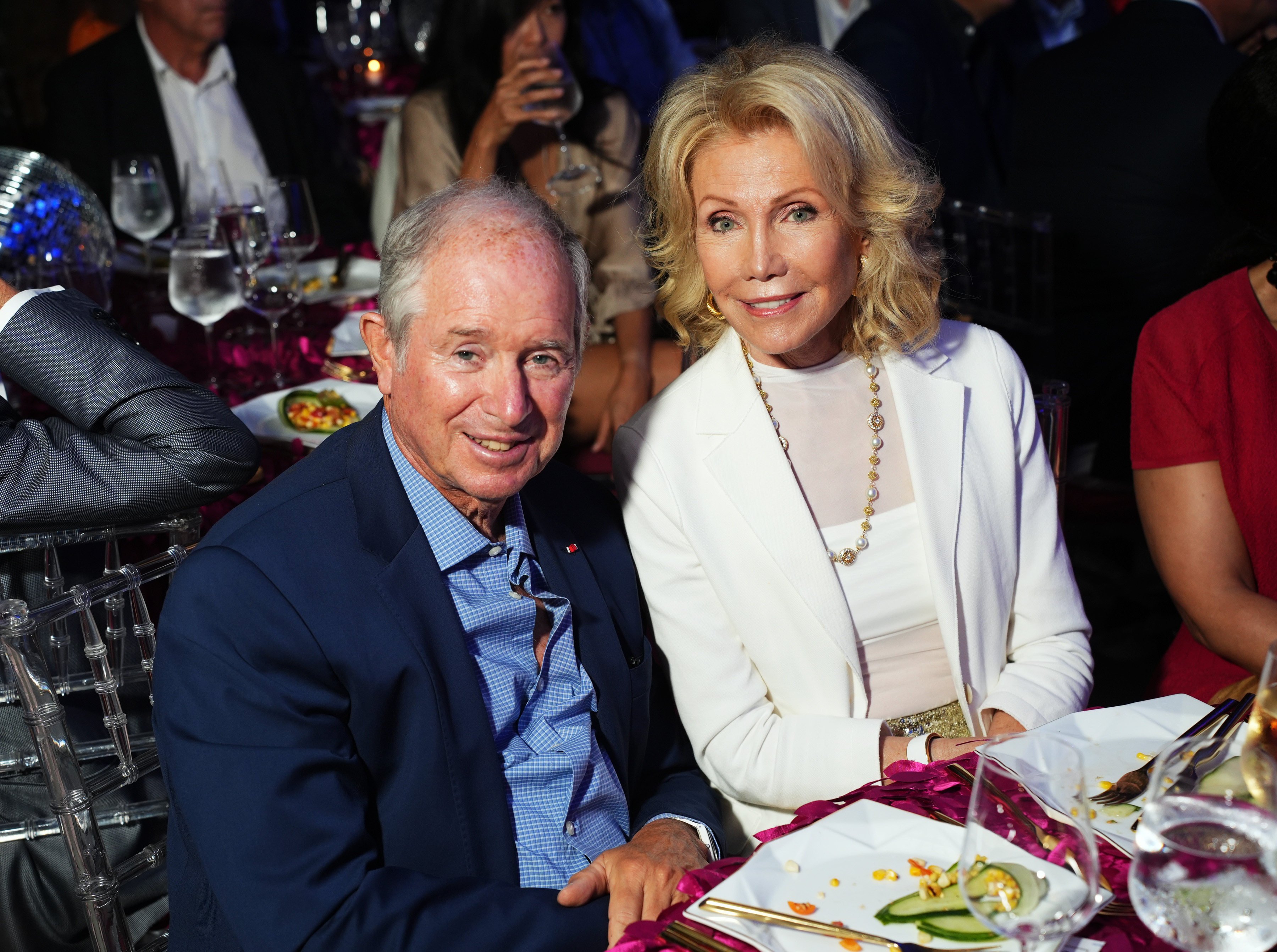 The daughter of a NYC firefighter, Christine Schwarzman is not your typical Wall Street wife ... so what do we know about the life of Stephen Schwarzman’s (left) partner? Photo: Getty Images