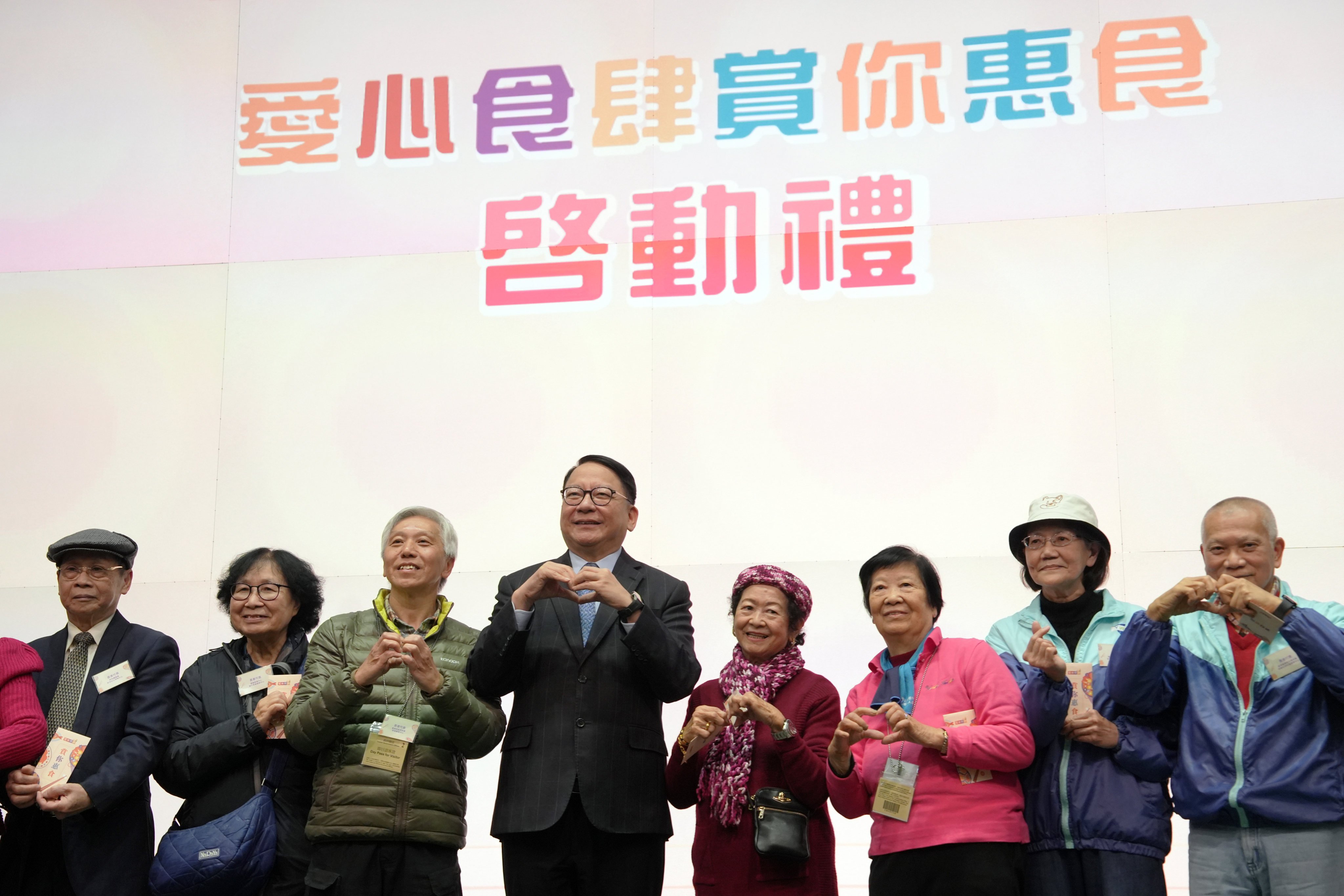 Chef Secretary Eric Chan (fourth left) attends the launch ceremony with representatives from the catering Industry and groups serving the elderly. Photo: Sun Yeung