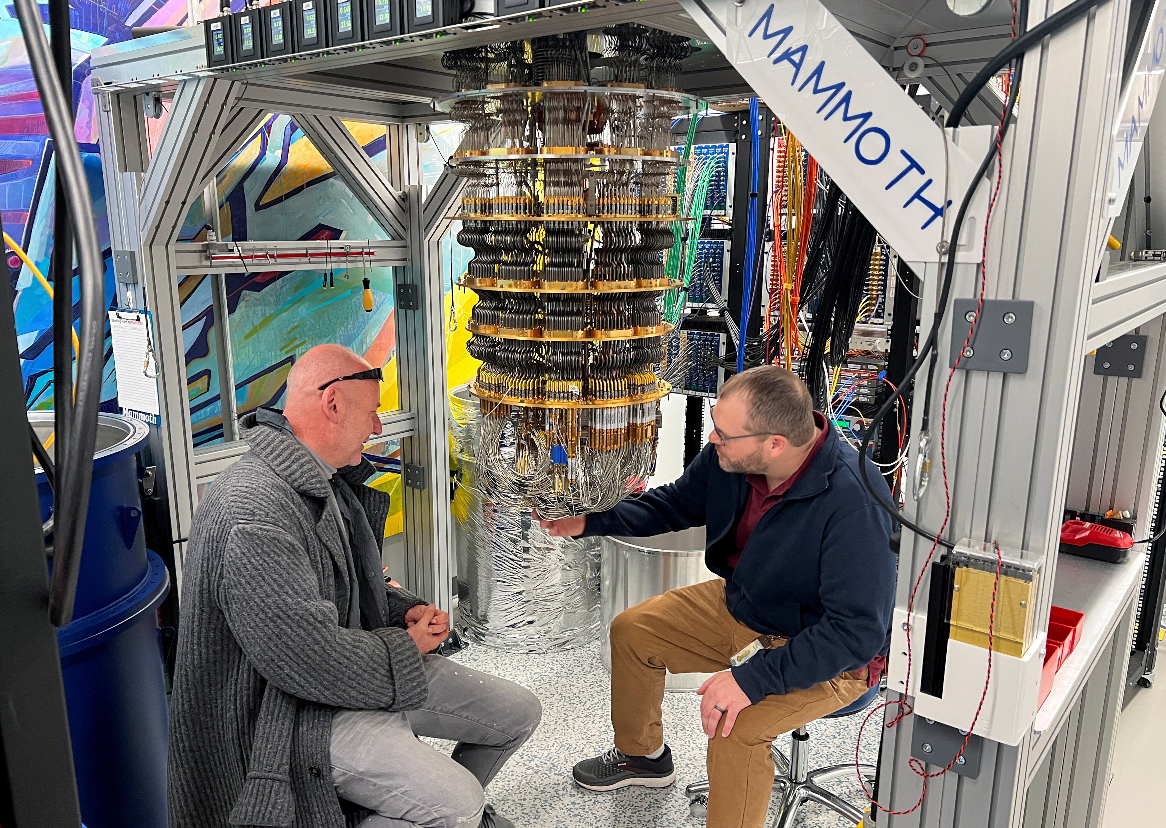 Google Quantum AI’s Hartmut Neven (left) and Anthony Megrant examine a cryostat refrigerator for cooling quantum computing chips at Google’s Quantum AI lab in Santa Barbara, California, on November 25, 2024. Photo: Reuters