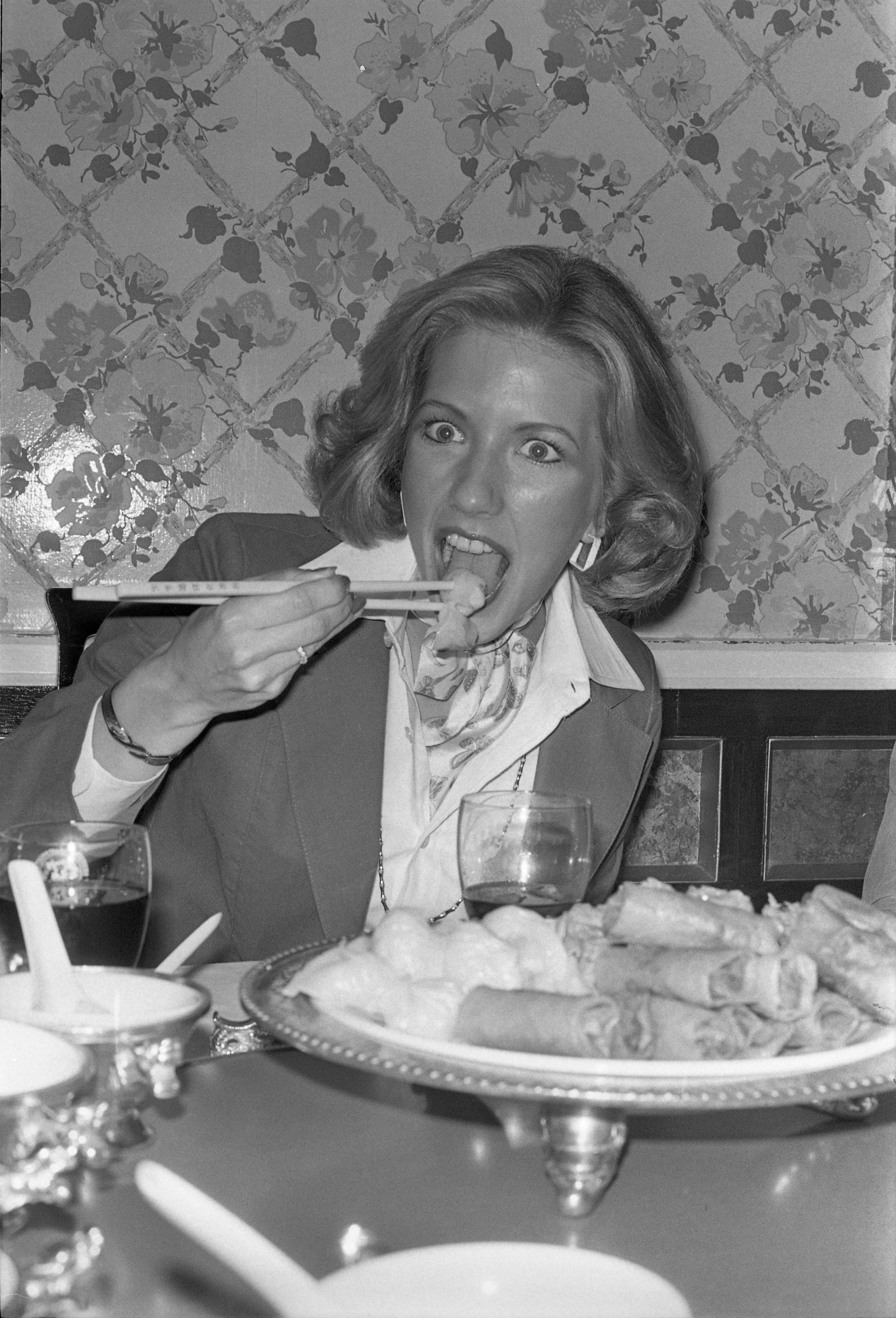 American visitor Ellen Clark enjoys dim sum in a local Hong Kong restaurant in 1977. Photo: SCMP