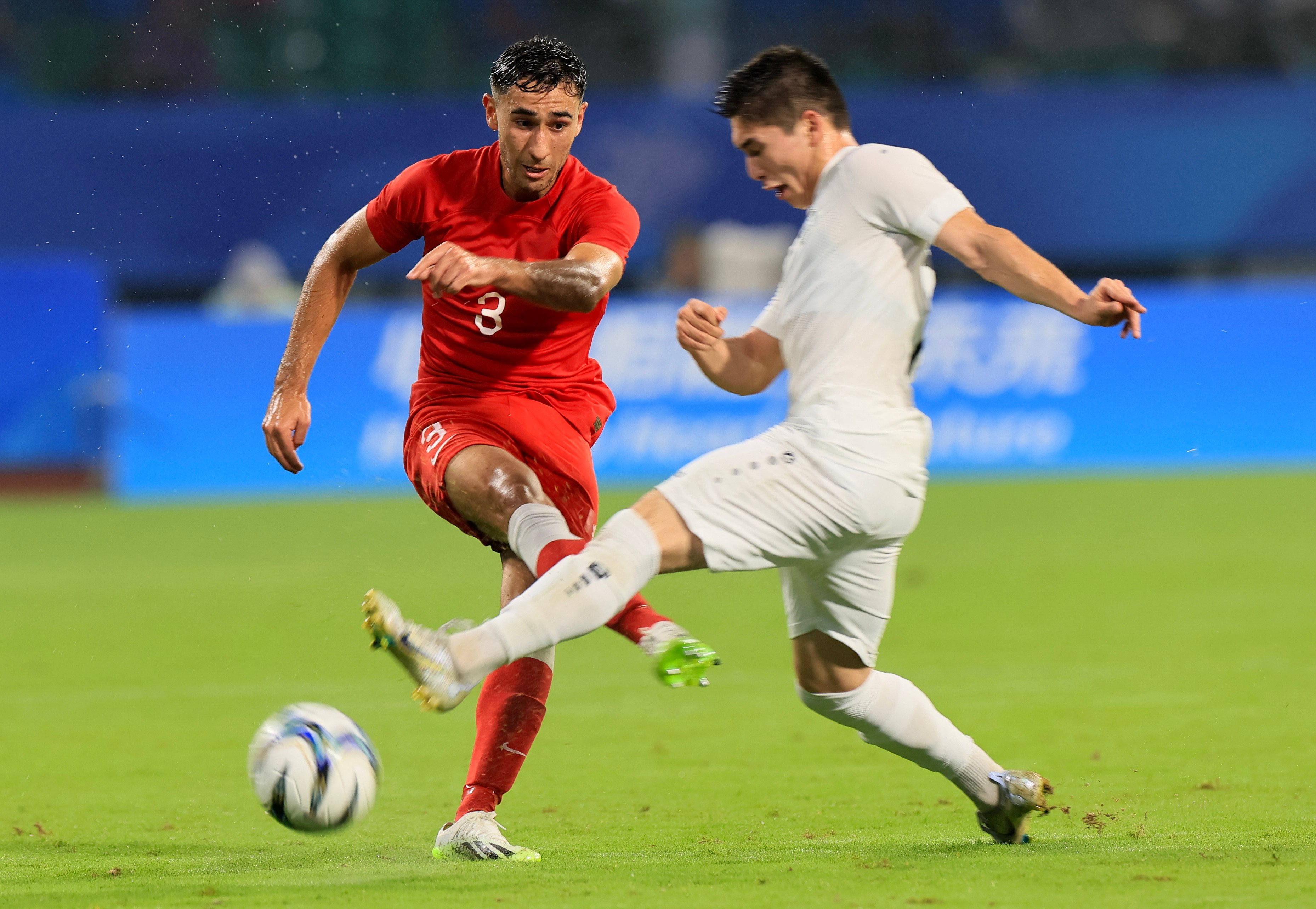 Hong Kong’s Alex Jojo (left) playing against Uzbekistan at the Asian Games in 2023. Photo: Dickson Lee