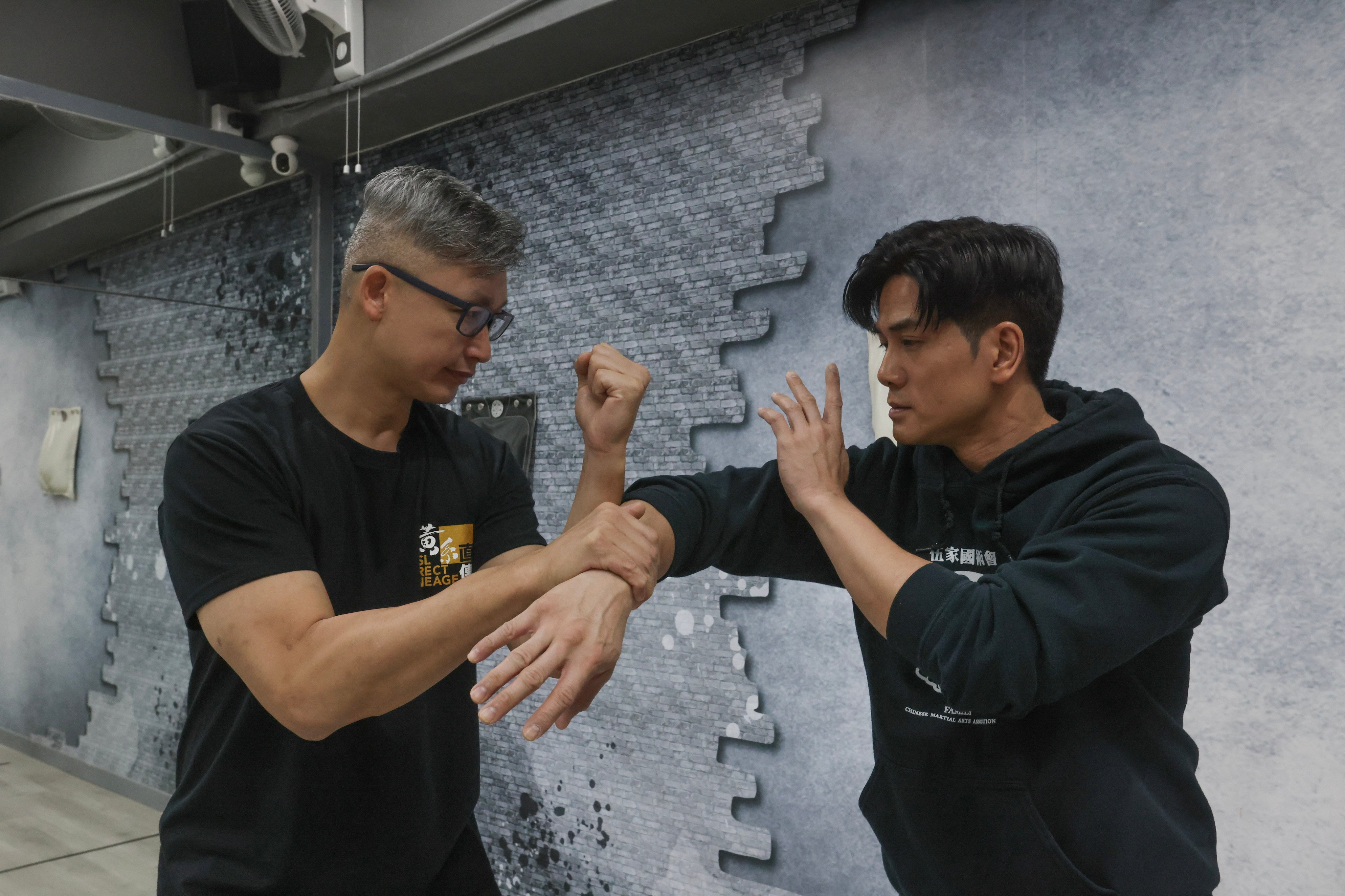 Pure Ving Tsun boss Jerry Yeung (left) and martial arts actor Philip Ng train at PVT Group Hong Kong in Tsim Sha Tsui on November 24, 2024. Both attended an event in honour of wing chun master Wong Shun-leung in November. Photo: Jonathan Wong