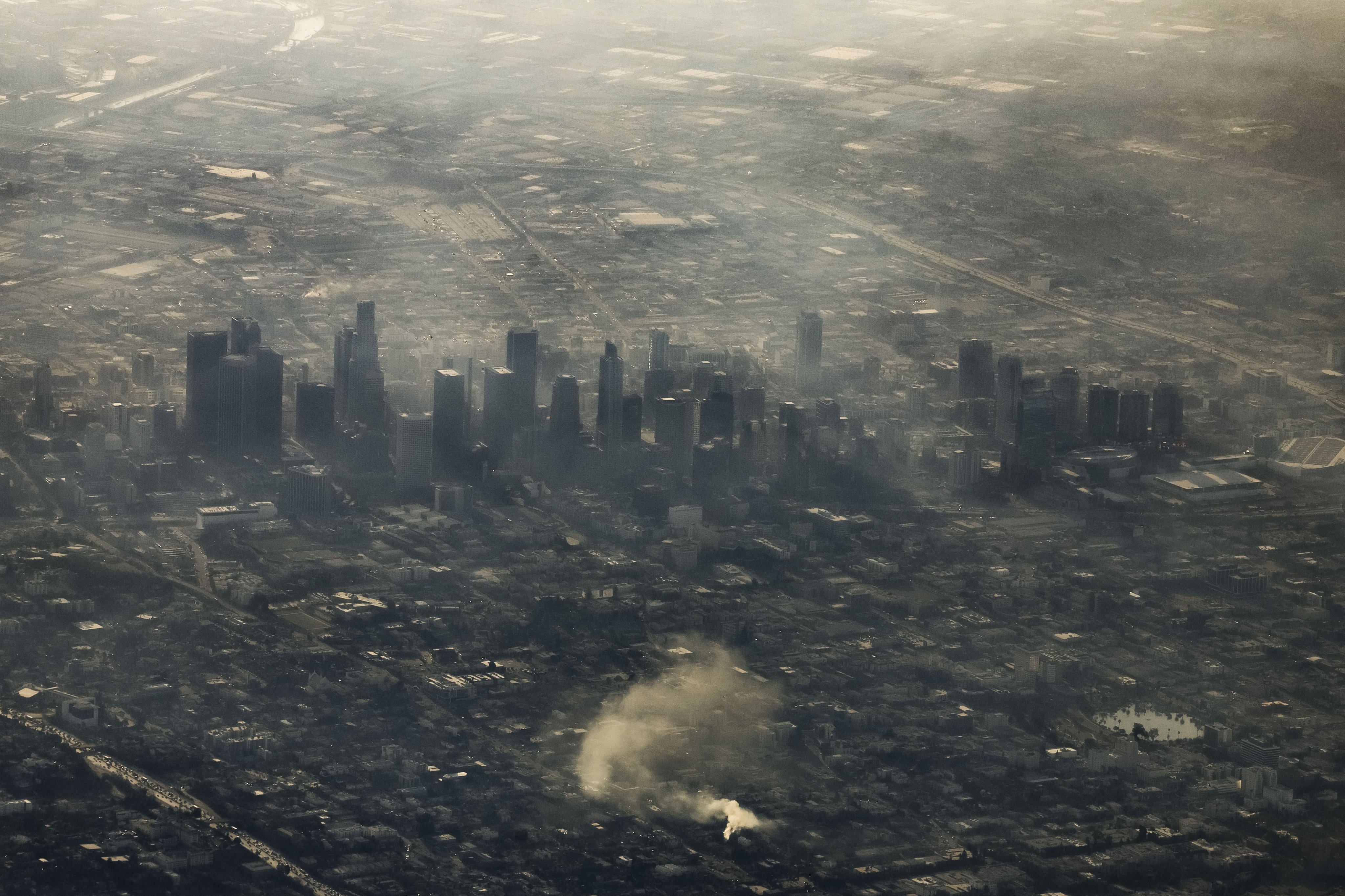 Buildings in downtown Los Angeles shrouded by smoke from multiple wildfires on Friday. Photo: EPA-EFE