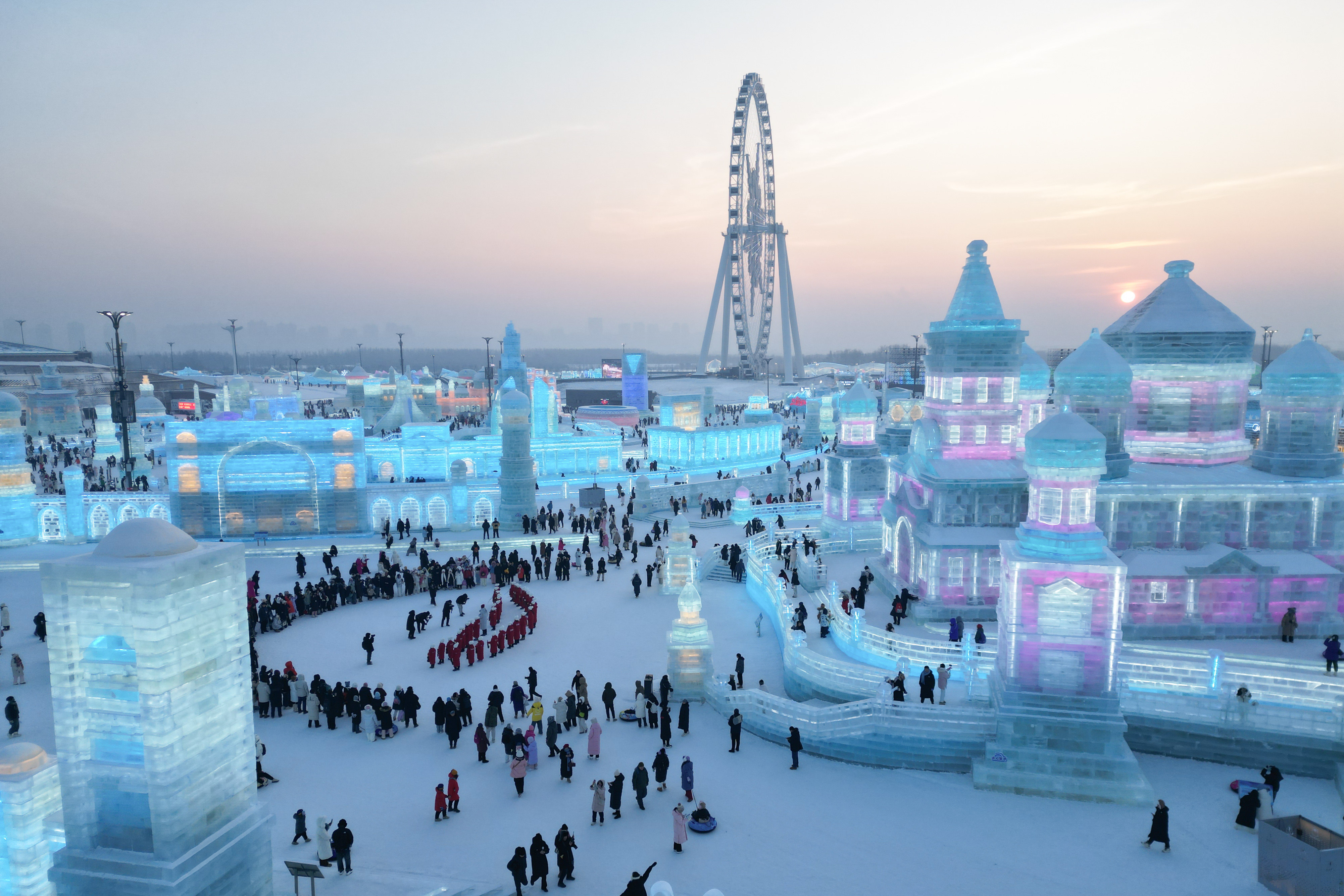 Harbin’s winter festival draws tourists for its ice sculptures and Madie’er ice cream, with visitors from southern China often needing extra warm clothing. Photo: Xinhua