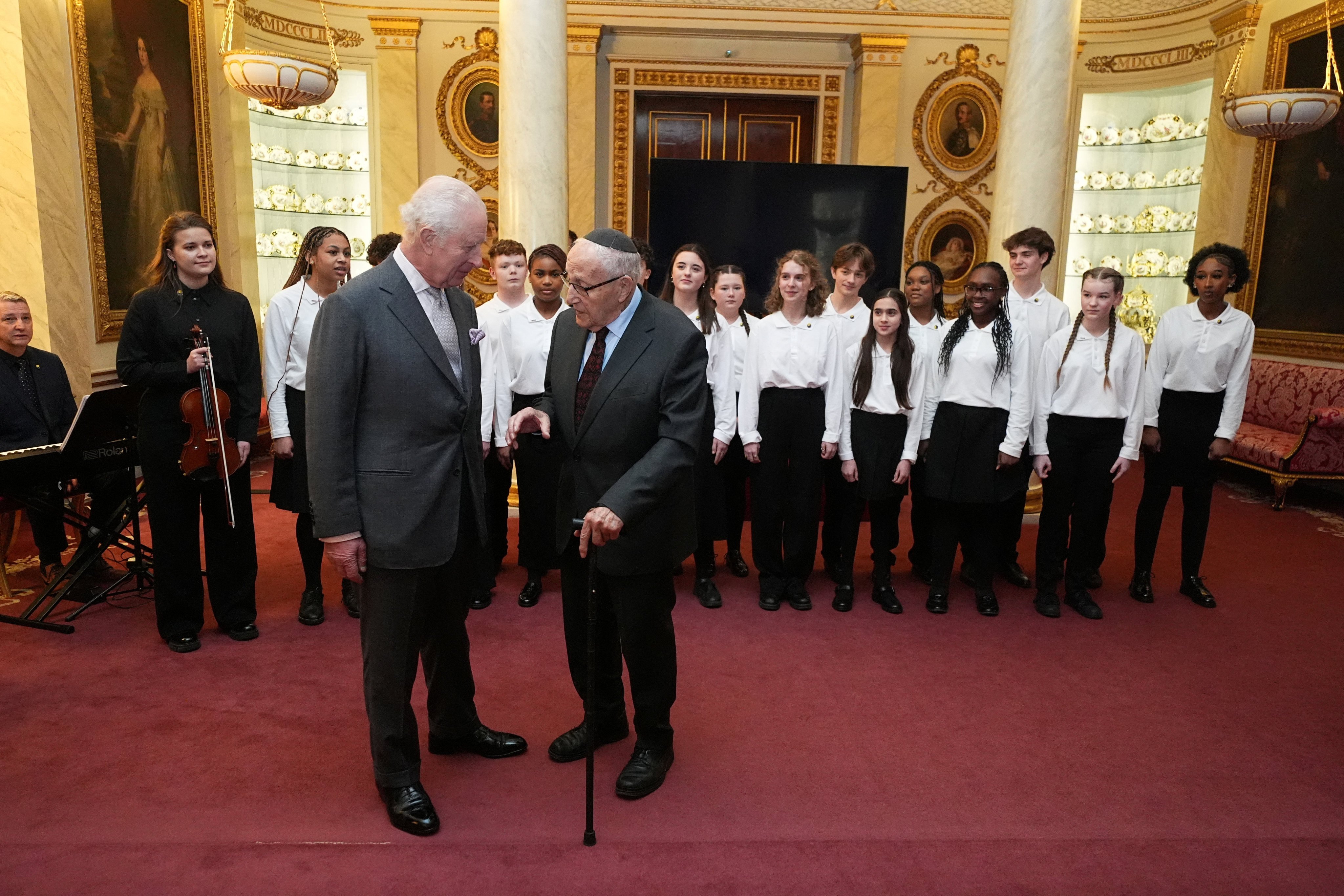 Britain’s King Charles III speaks to Holocaust survivor Manfred Goldberg during a reception marking Holocaust Memorial Day at Buckingham Palace in London, UK on Monday. Photo: Pool via Reuters