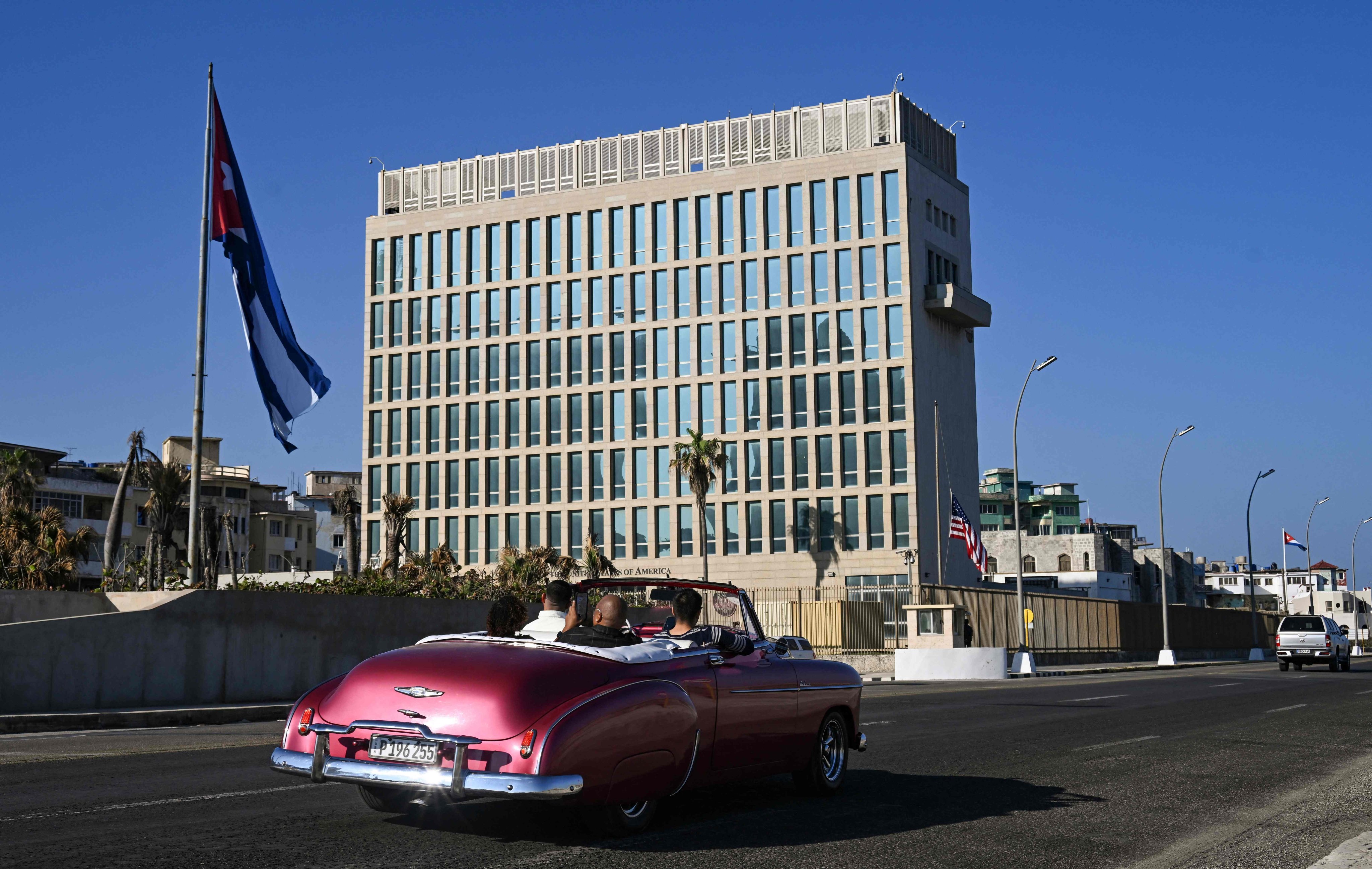 A car drives past the US Embassy in Havana. Photo: AFP