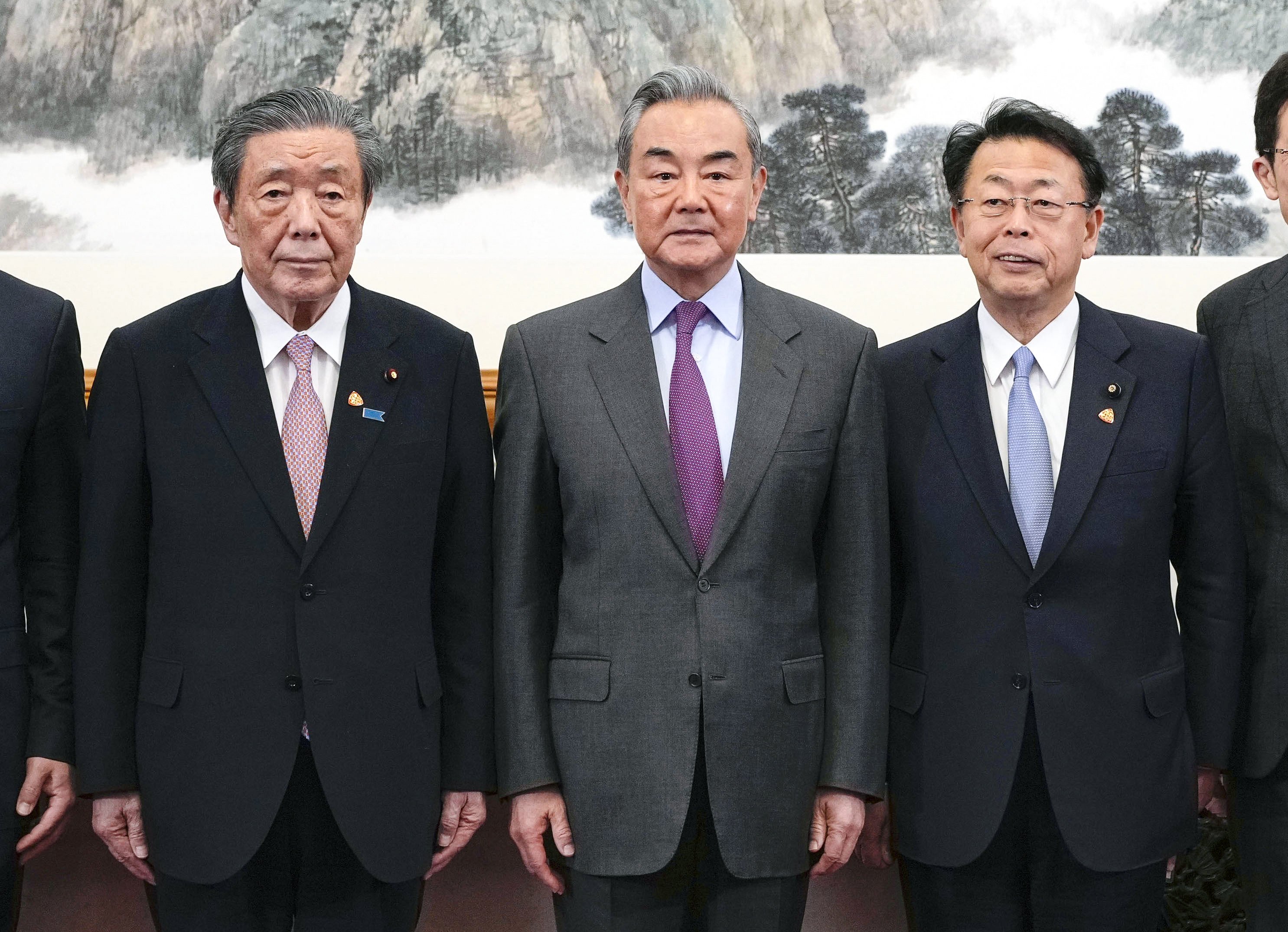 Hiroshi Moriyama (left), secretary general of Japan’s ruling Liberal Democratic Party, Chinese Foreign Minister Wang Yi, and Makoto Nishida, secretary general of Japan’s Komeito party, in Beijing on Tuesday. Photo: Kyodo