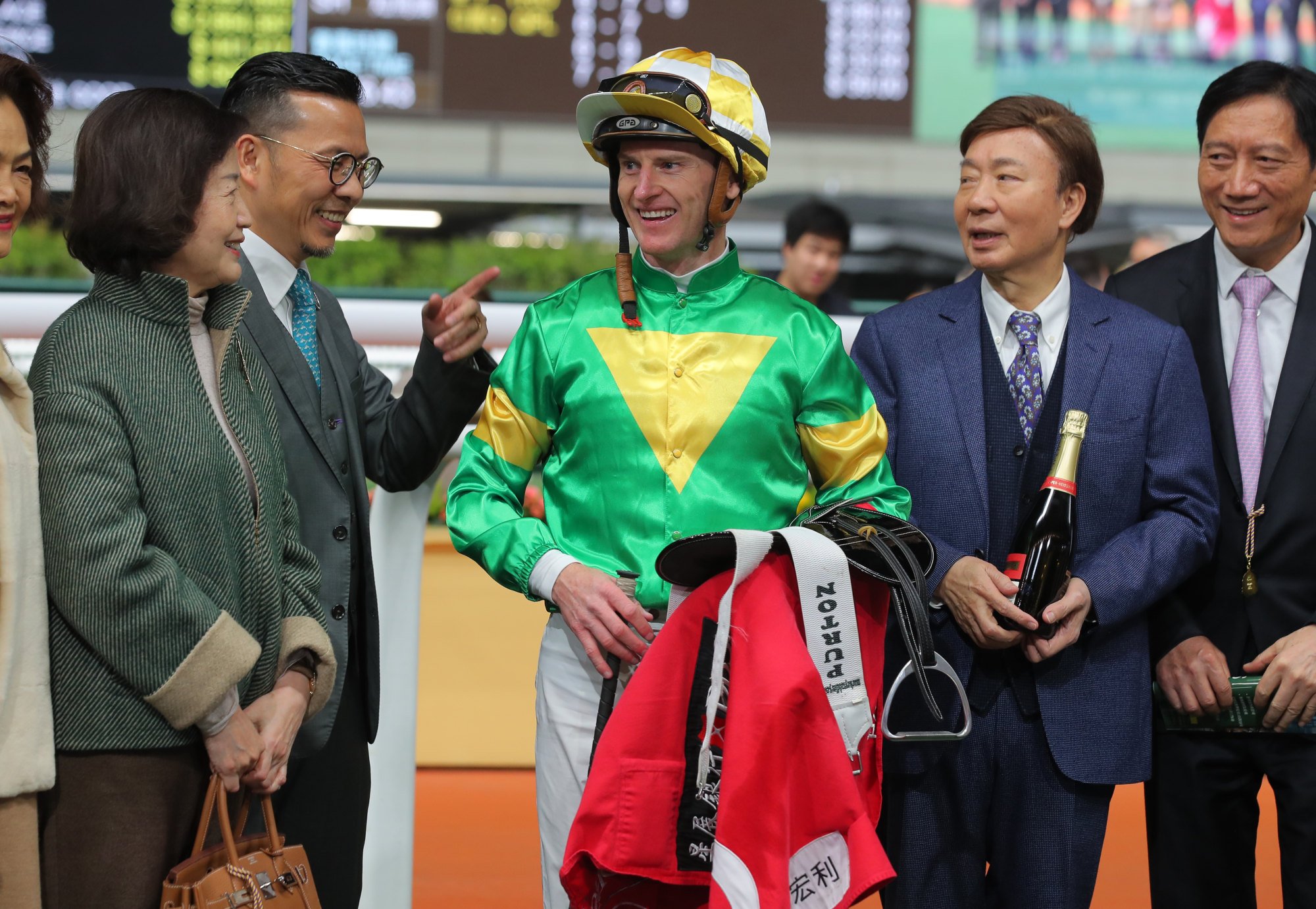 Trainer Frankie Lor (second from left), jockey Zac Purton and connections of Bottomuptogether.