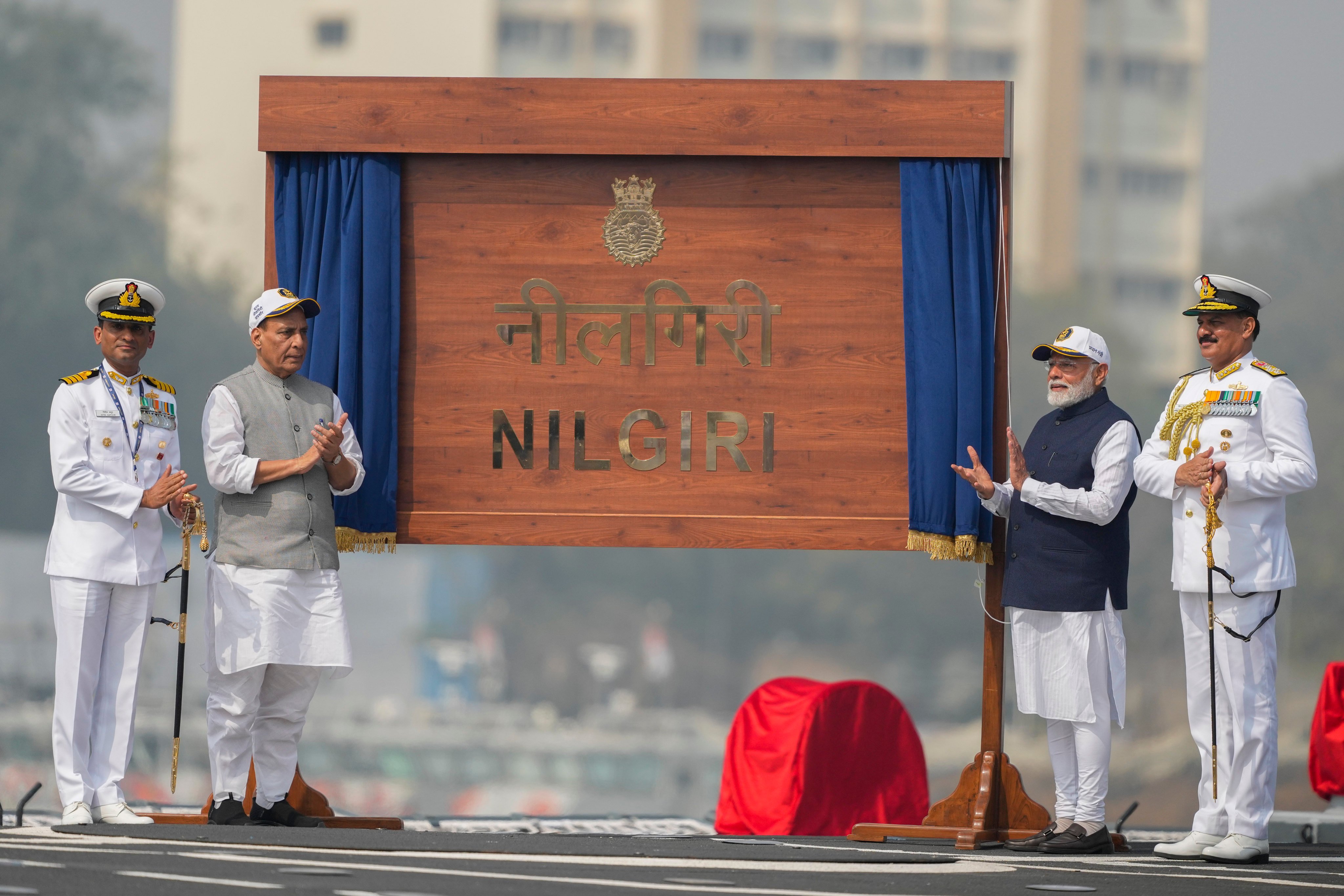 India’s Navy Chief Dinesh Kumar Tripathi (left) and Prime Minister Narendra Modi on the deck of INS Nilgiri during its commissioning ceremony at a naval dockyard in Mumbai. Photo: AP