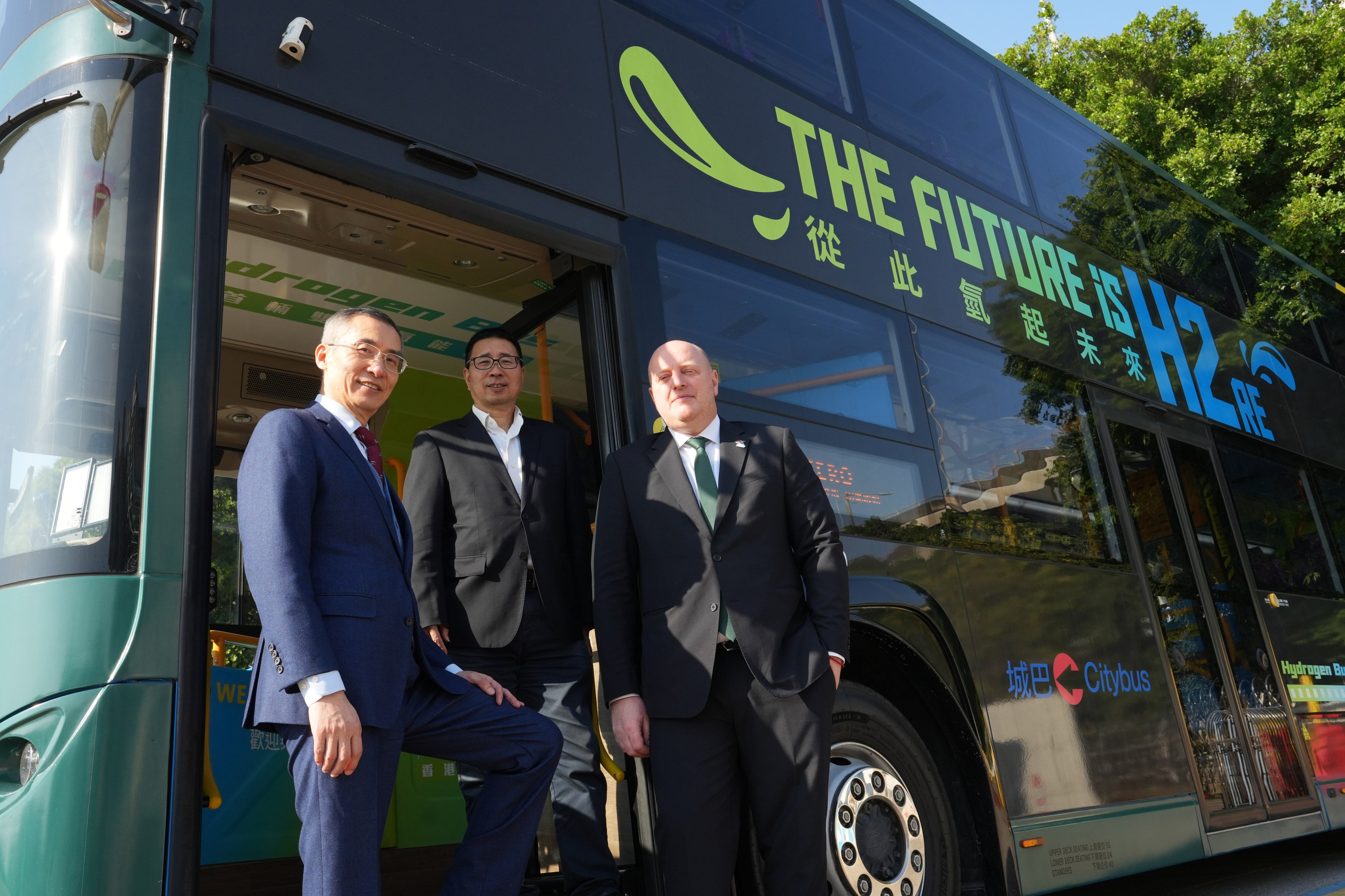 From left, Yang Dong, CEO of Hans Group; He Wen Zhong, chairman of Grand Resource Hydrogen; and Richard Hall, managing director of Citybus. Photo: Sun Yeung