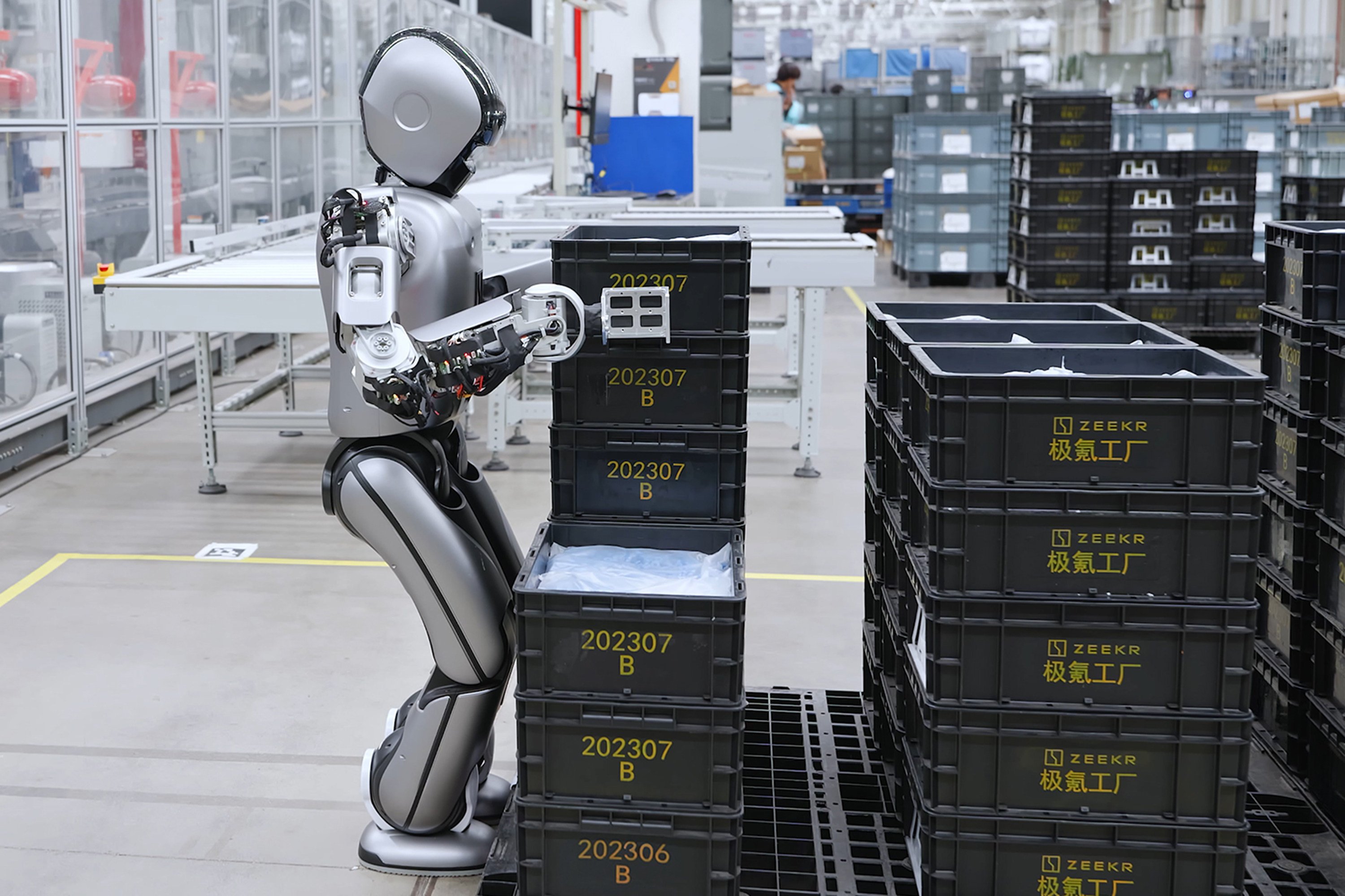 A humanoid robot developed by UBTech moves a heavy load onto an automated guided vehicle at Zeekr’s smart factory in Ningbo, Zhejiang province. Photo: VCG via Getty Images