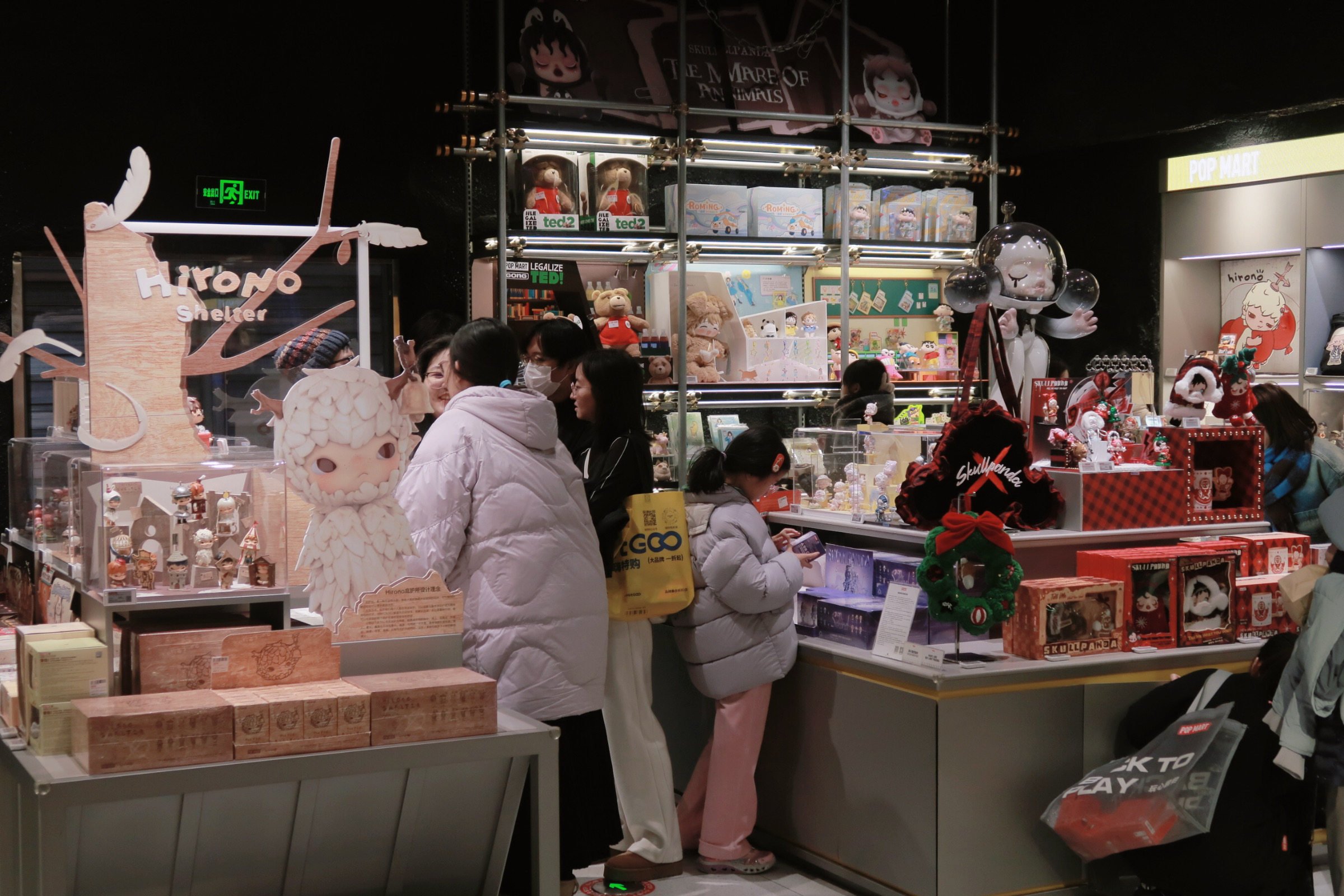 Shoppers select toys at a store in a Beijing shopping mall last month. Photo: Xinhua