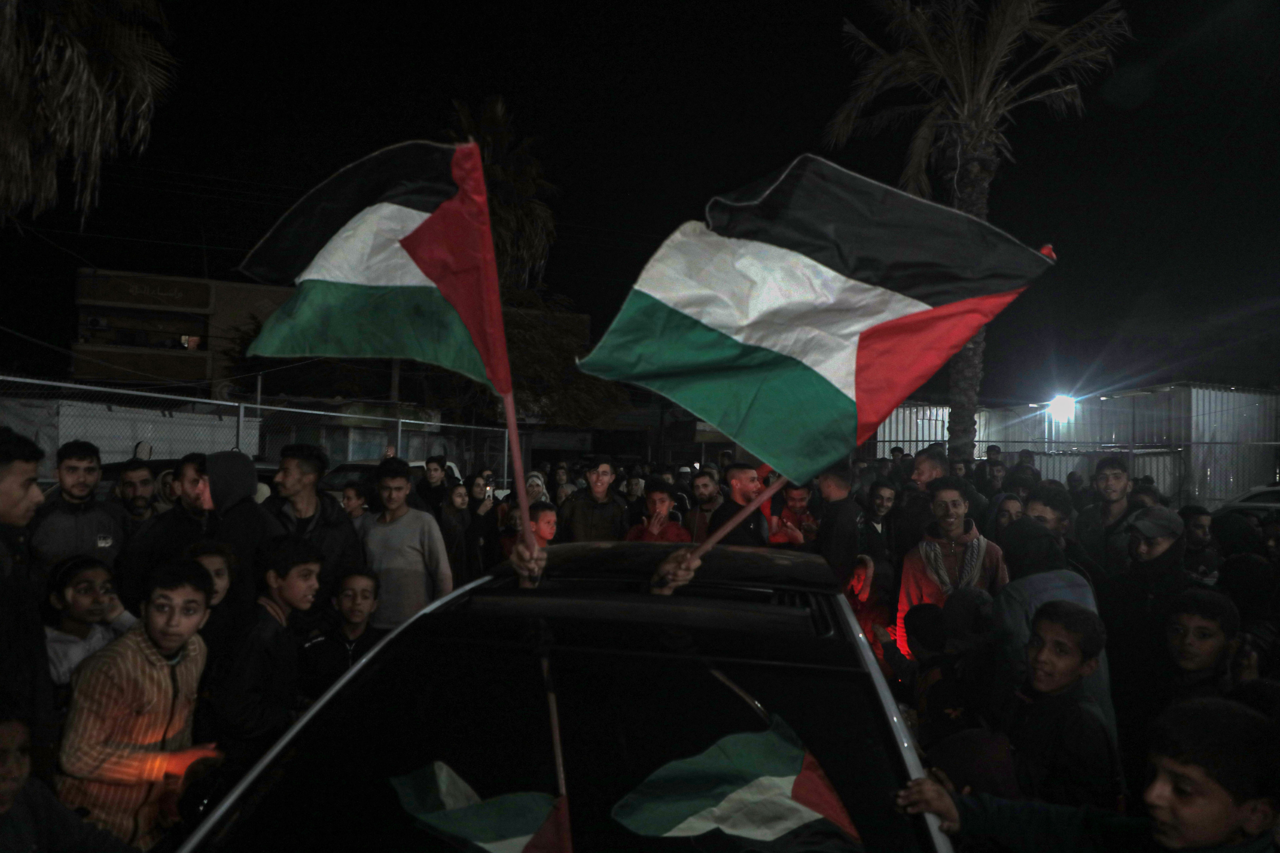 Palestinians react to news on a ceasefire deal with Israel, in Deir al-Balah in the central Gaza Strip. Photo: Xinhua