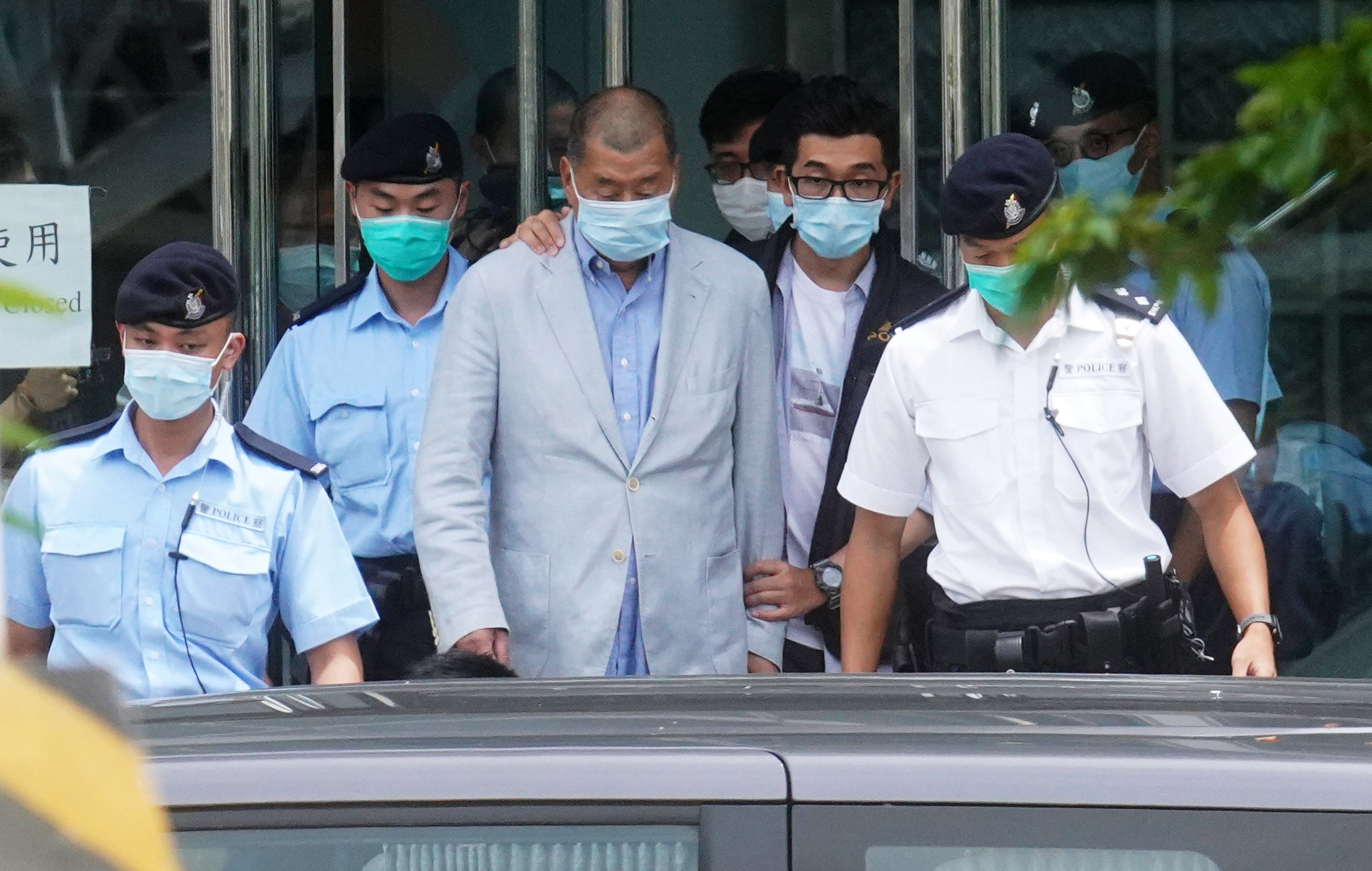 Prosecutors have accused Jimmy Lai (centre) of using his tabloid to instigate Western sanctions and incite public hatred towards mainland and Hong Kong authorities. Photo: Winson Wong