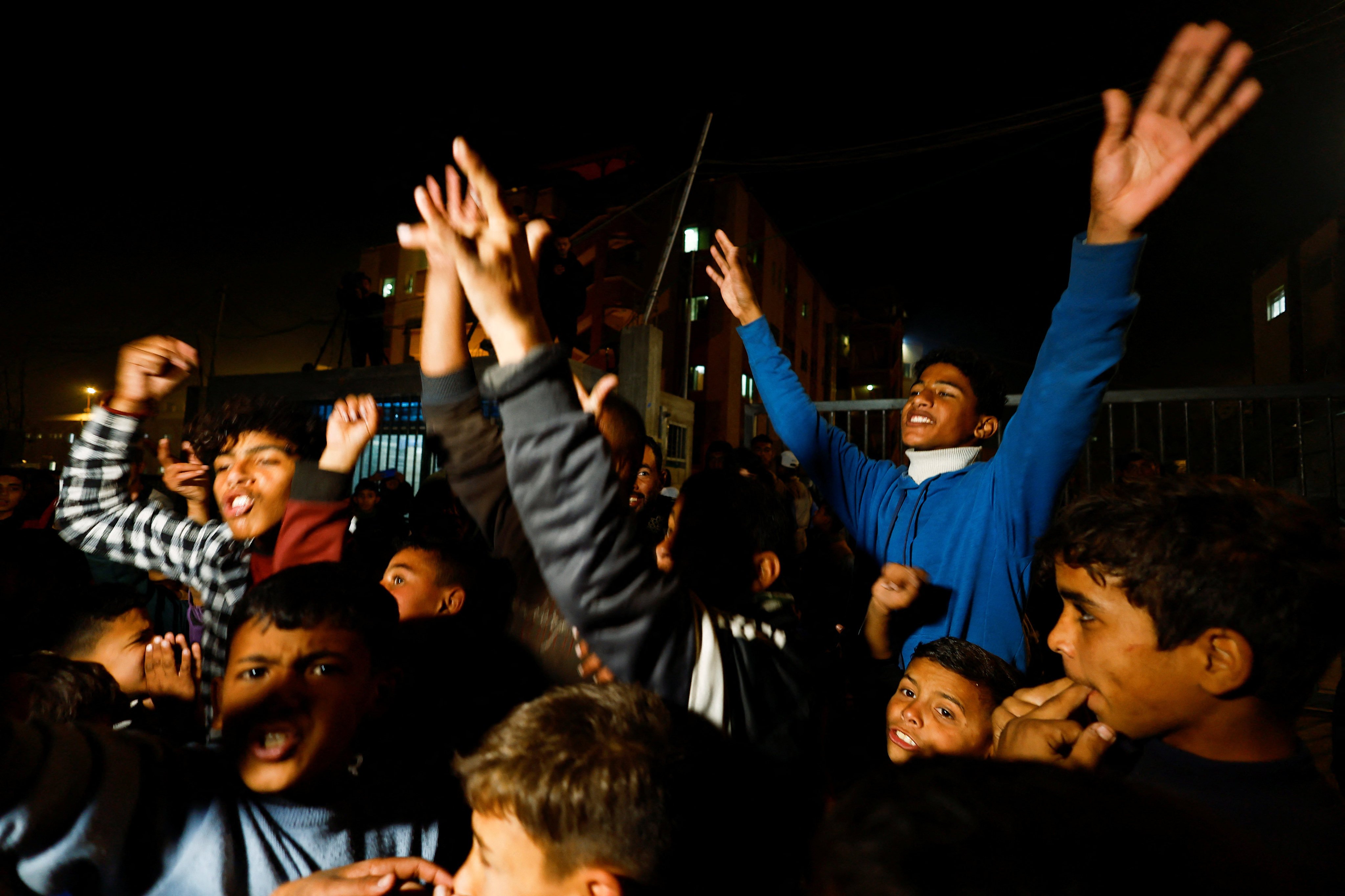 Palestinians react as they wait for news of a ceasefire deal with Israel, in Khan Younis in the southern Gaza Strip on Wednesday. Photo: Reuters