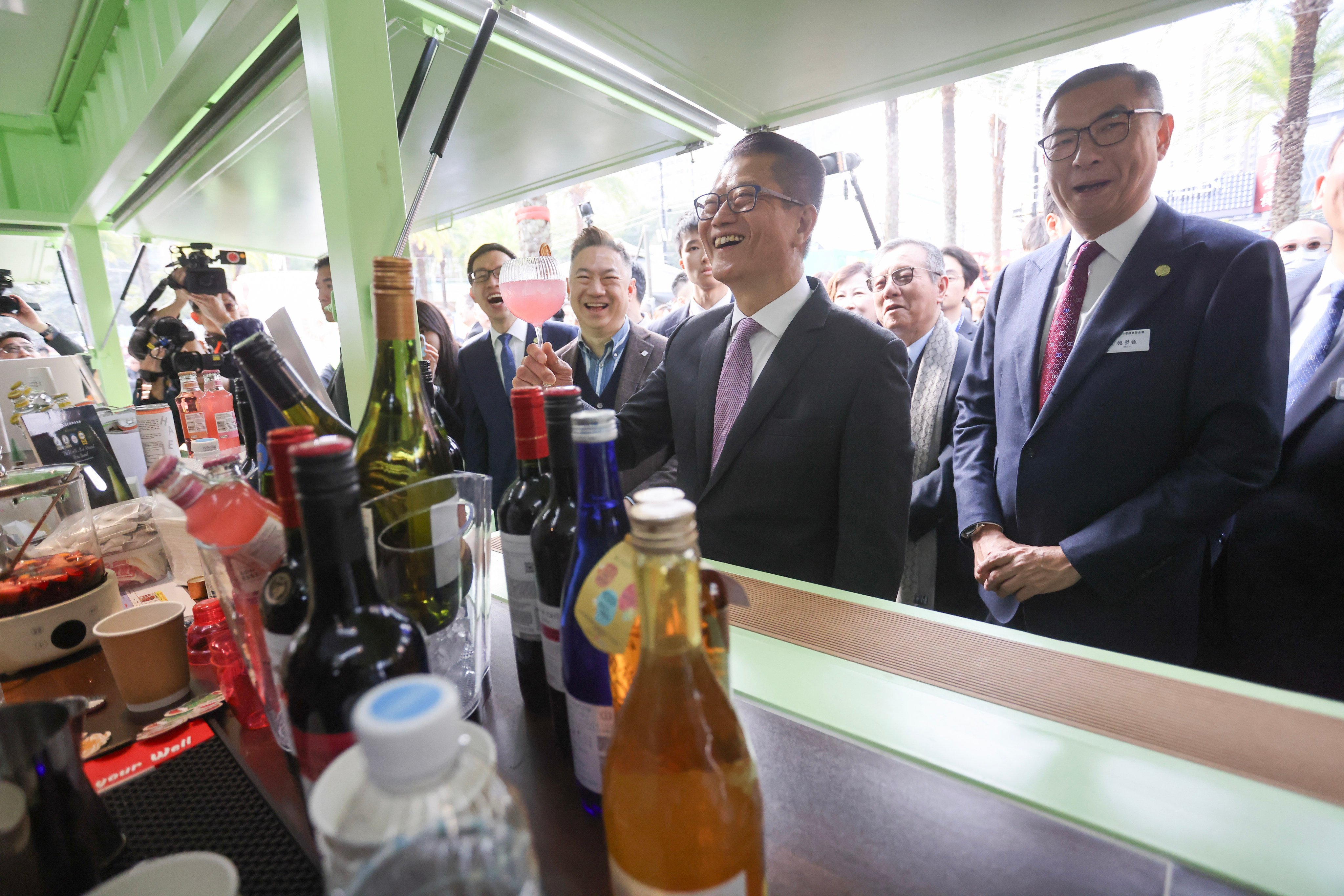 Financial Secretary Paul Chan Mo-po (centre) visits the 58th Hong Kong Brands & Products Expo at Victoria Park on December 14. His track record is excellent and green shoots of recovery are in abundance. Photo: Jonathan Wong