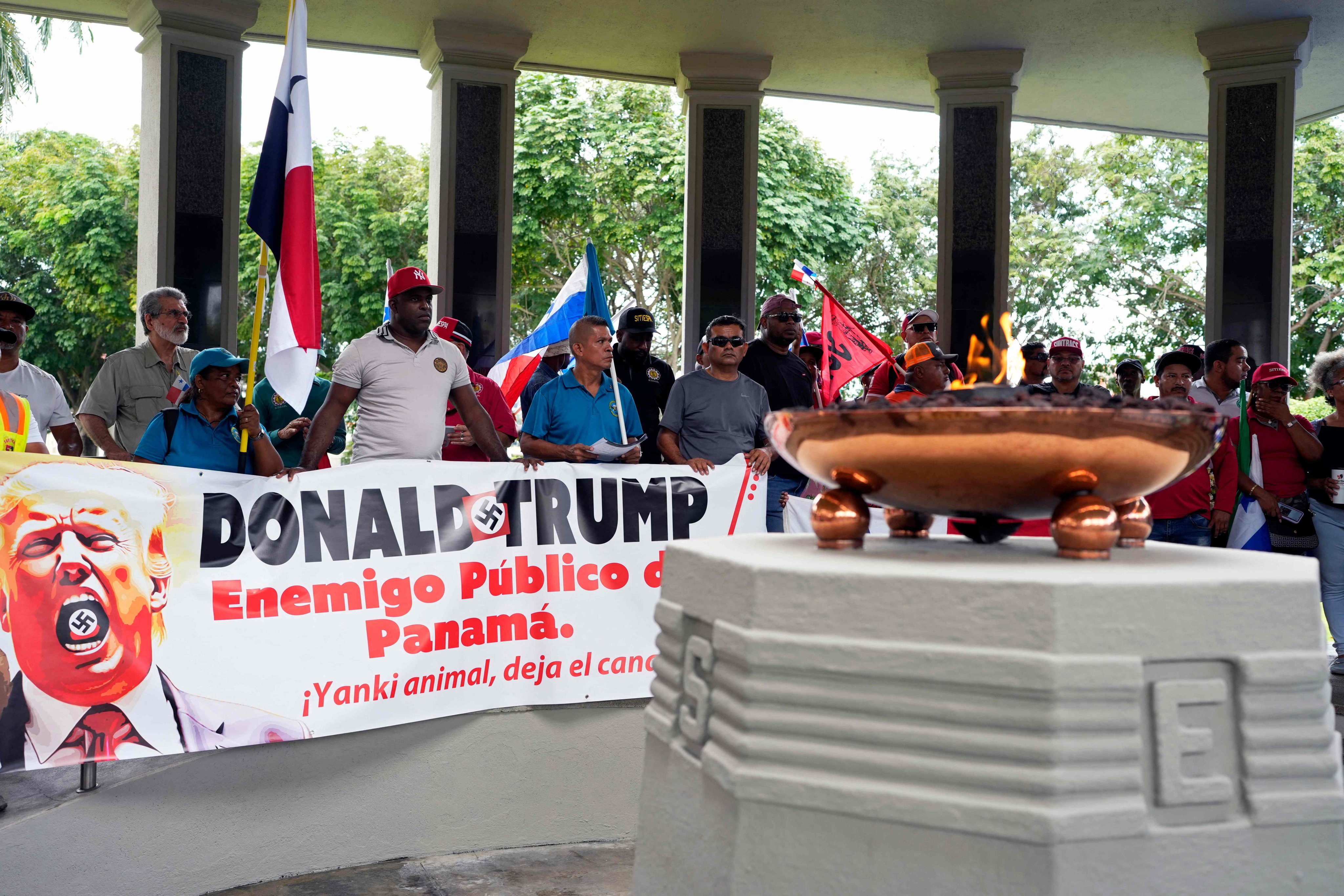 A protest against Donald Trump at the Monument to the Martyrs of the 1964 demonstration against US sovereignty over the Panama Canal, is held in Panama City on December 31 as the country marks the 25th anniversary of the US handover of the canal. Photo: AFP