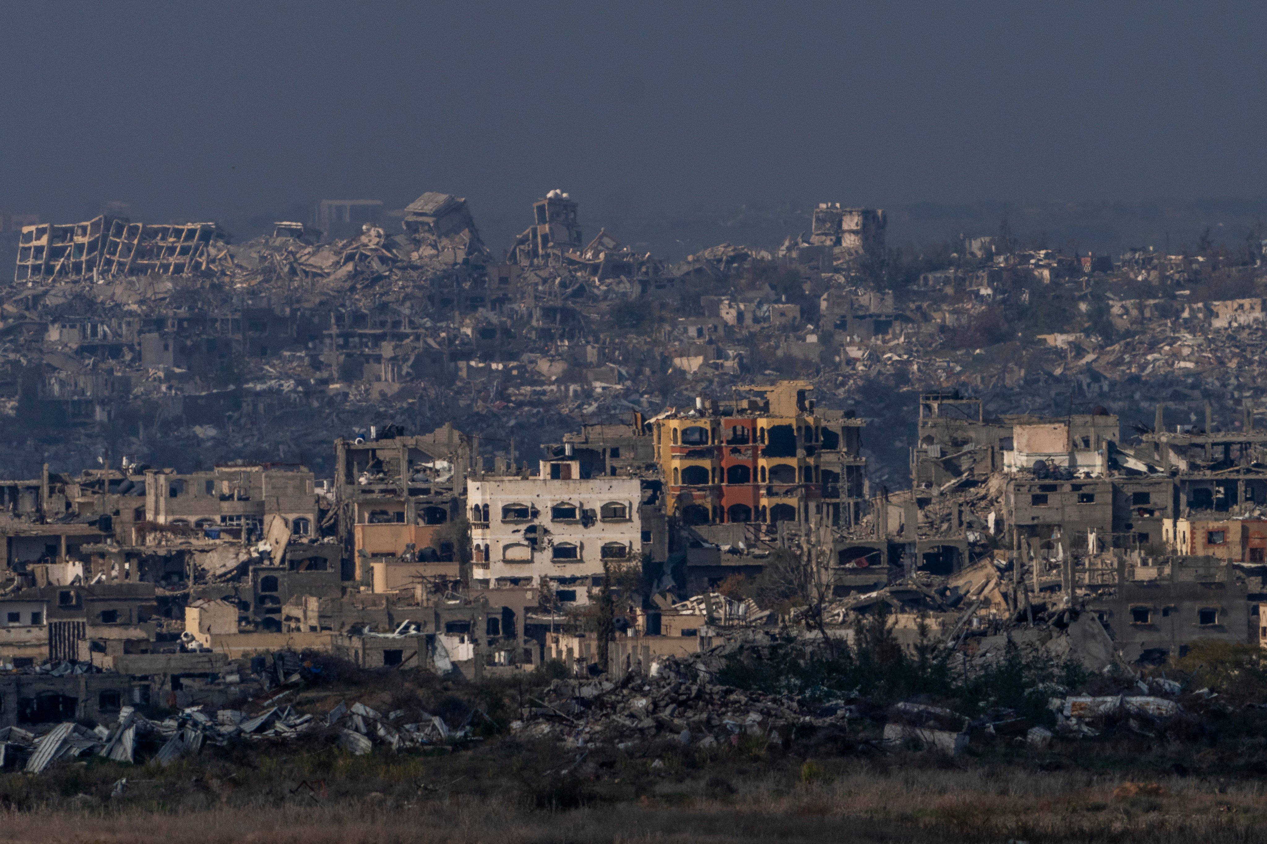 Destroyed buildings by Israeli bombardments as seen inside the Gaza Strip from southern Israel, January 16, 2025. Photo: AP