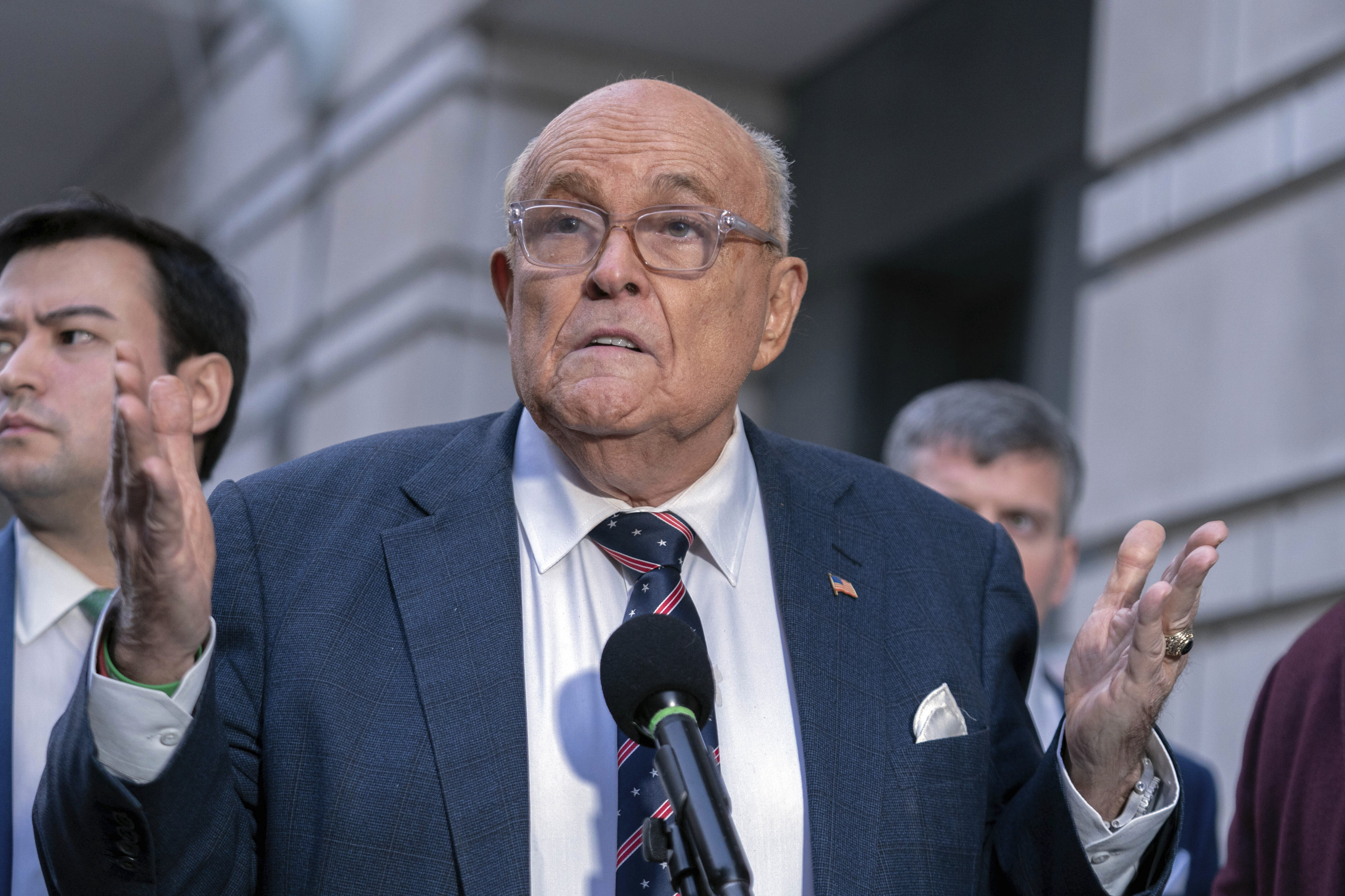 Rudy Giuliani speaks after leaving federal court in Washington on January 10. Photo: AP