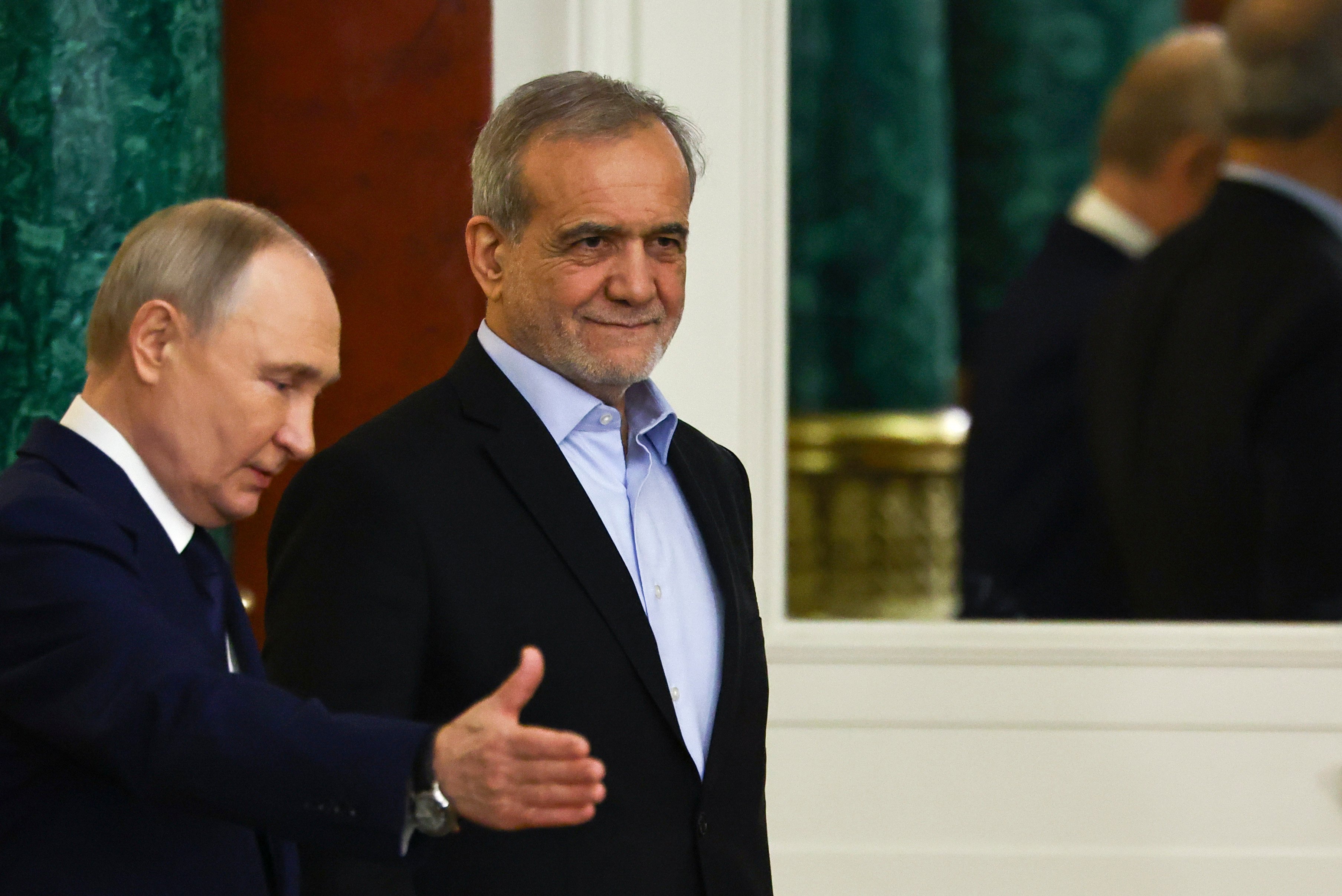 Russian President Vladimir Putin (left) and Iranian President Masoud Pezeshkian as they attend a signing ceremony at the Kremlin. Photo: AP