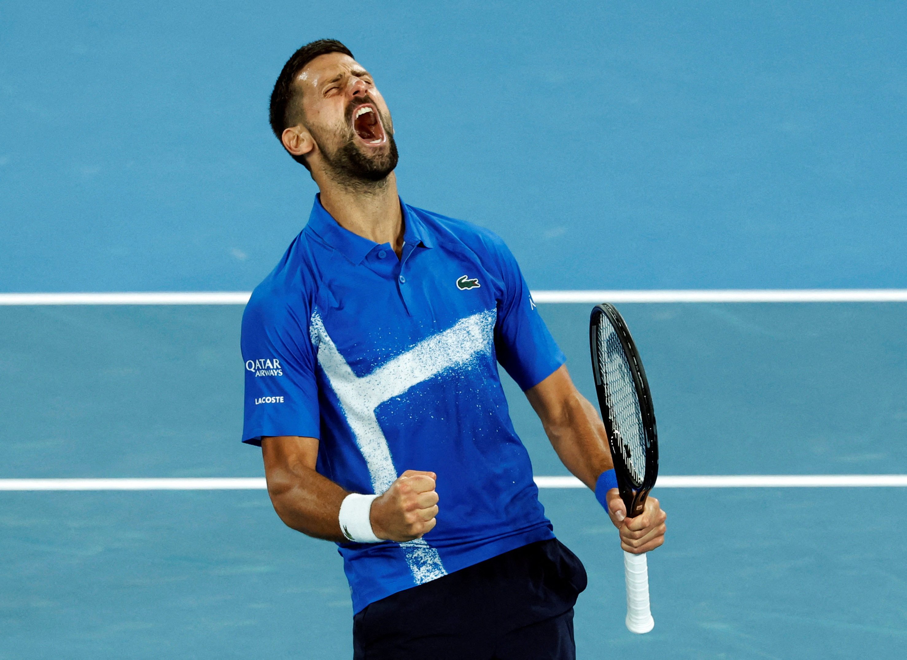 Novak Djokovic lets out a roar after winning his third-round match against Tomas Machac on Friday. Photo: Reuters