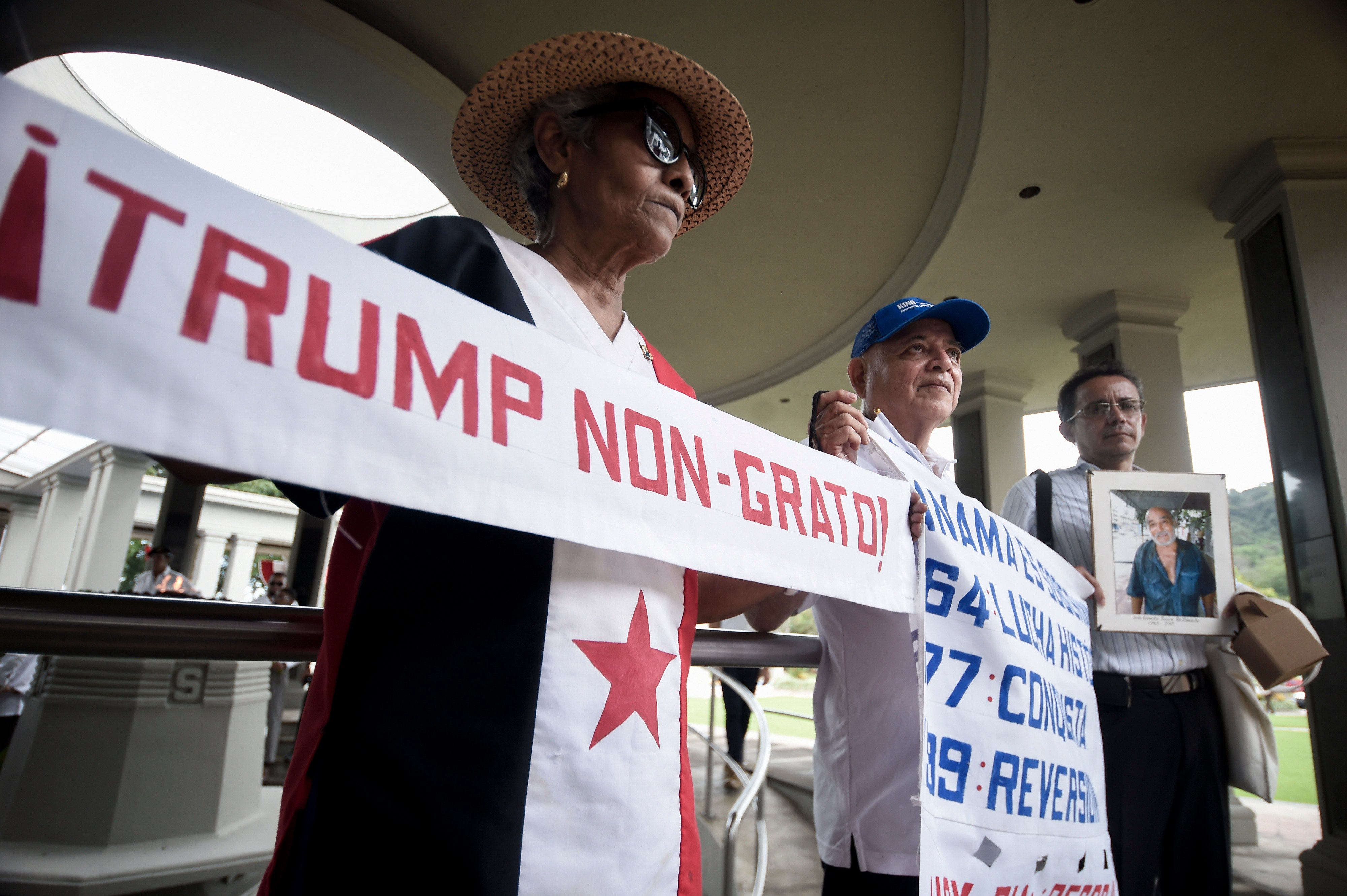 A resident of Panama City, Panama holds a banner that reads “Trump not welcome!” as part of the commemoration of Martyrs’ Day, a Panamanian day of national mourning, on January 9. US president-elect Donald Trump has floated the prospect of reclaiming the Panama Canal by force. Photo: AP