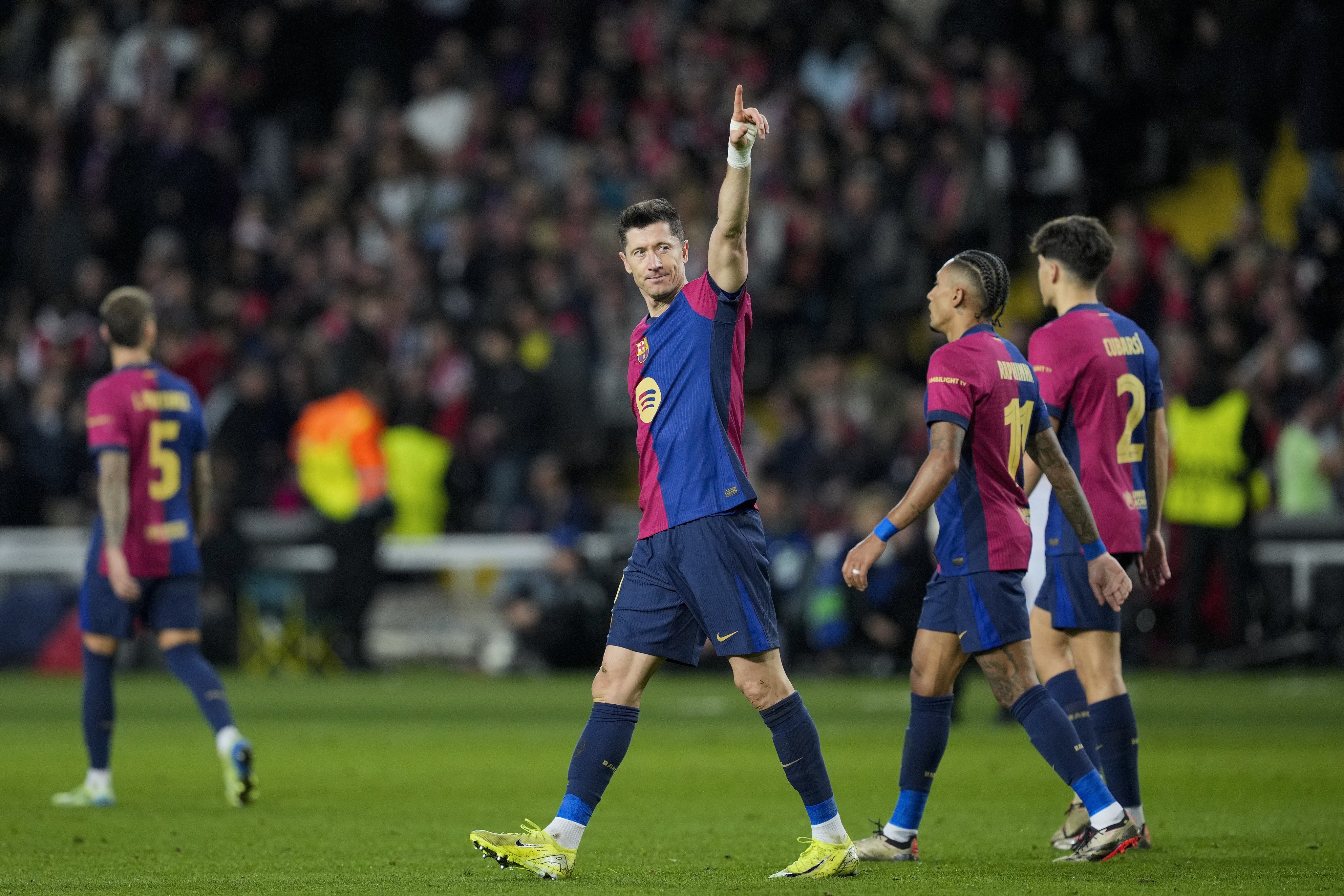 Star striker Robert Lewandowski celebrates after scoring for Barcelona in a recent Champions league match. Photo:  EPA-EFE