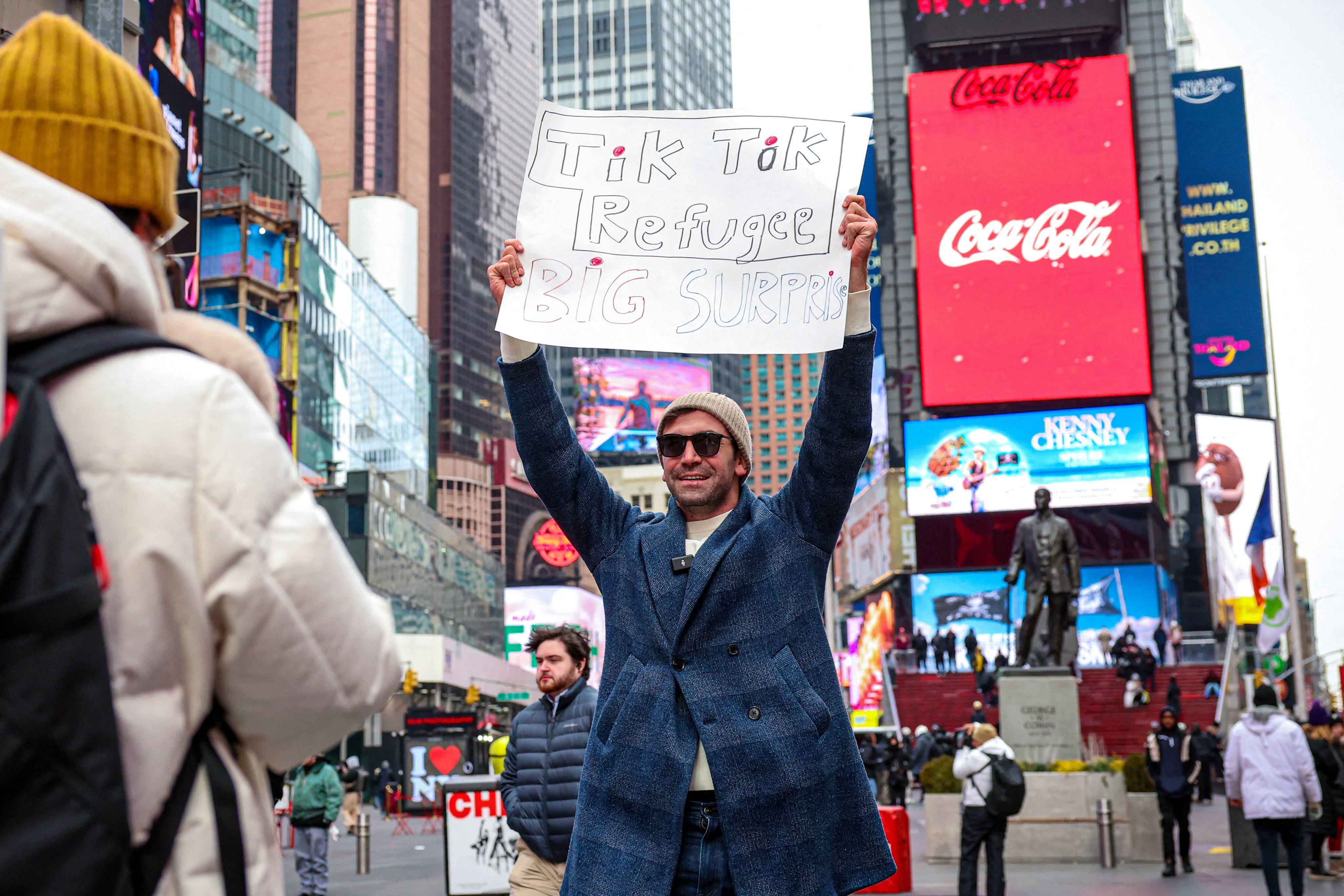 A social media influencer films a video in New York’s Times Square to announce his departure from TikTok for rival Chinese app RedNote. Photo: Reuters