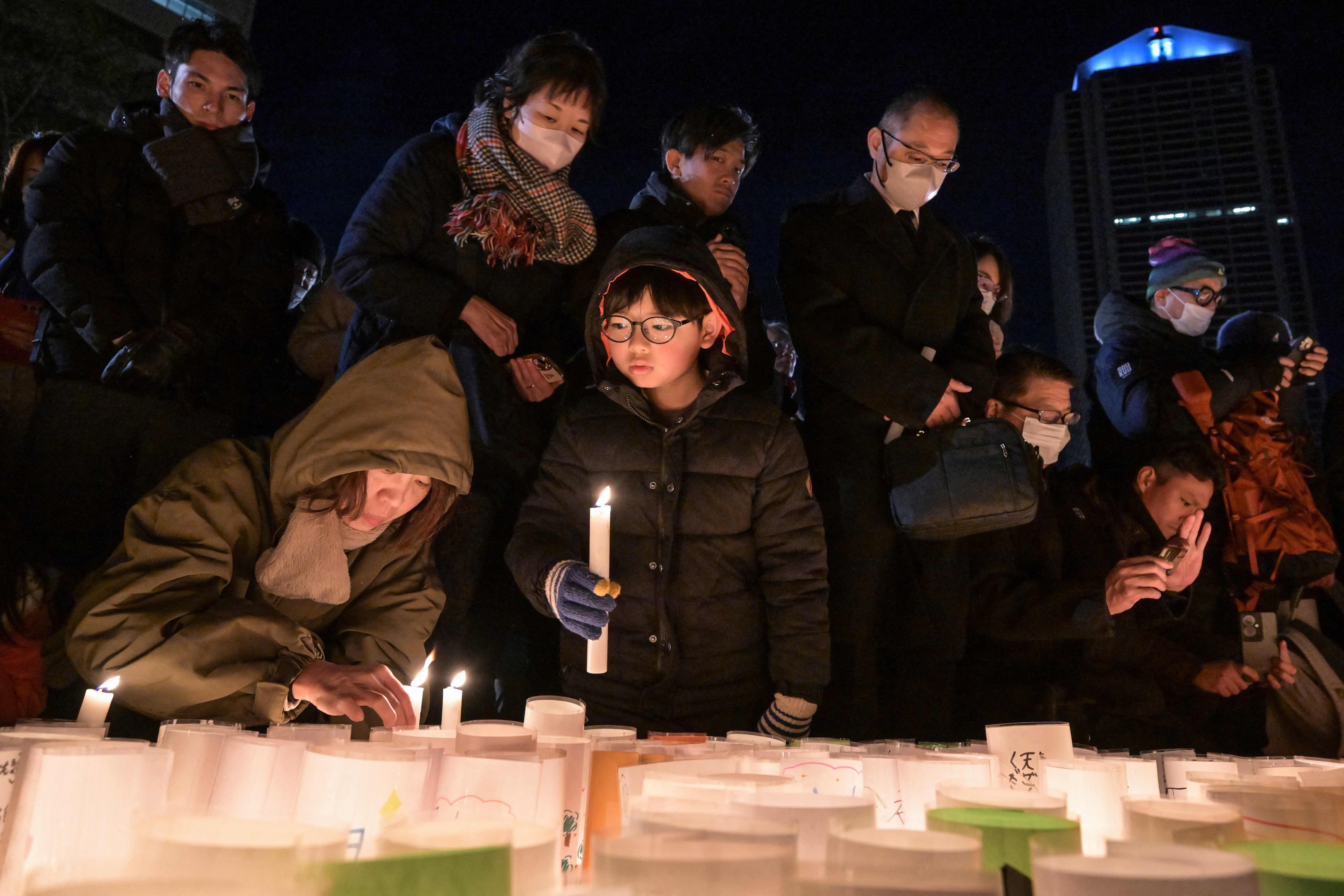 People mark the 30th anniversary of the 1995 “Great Hanshin Earthquake” in Kobe on Friday. Photo: AFP