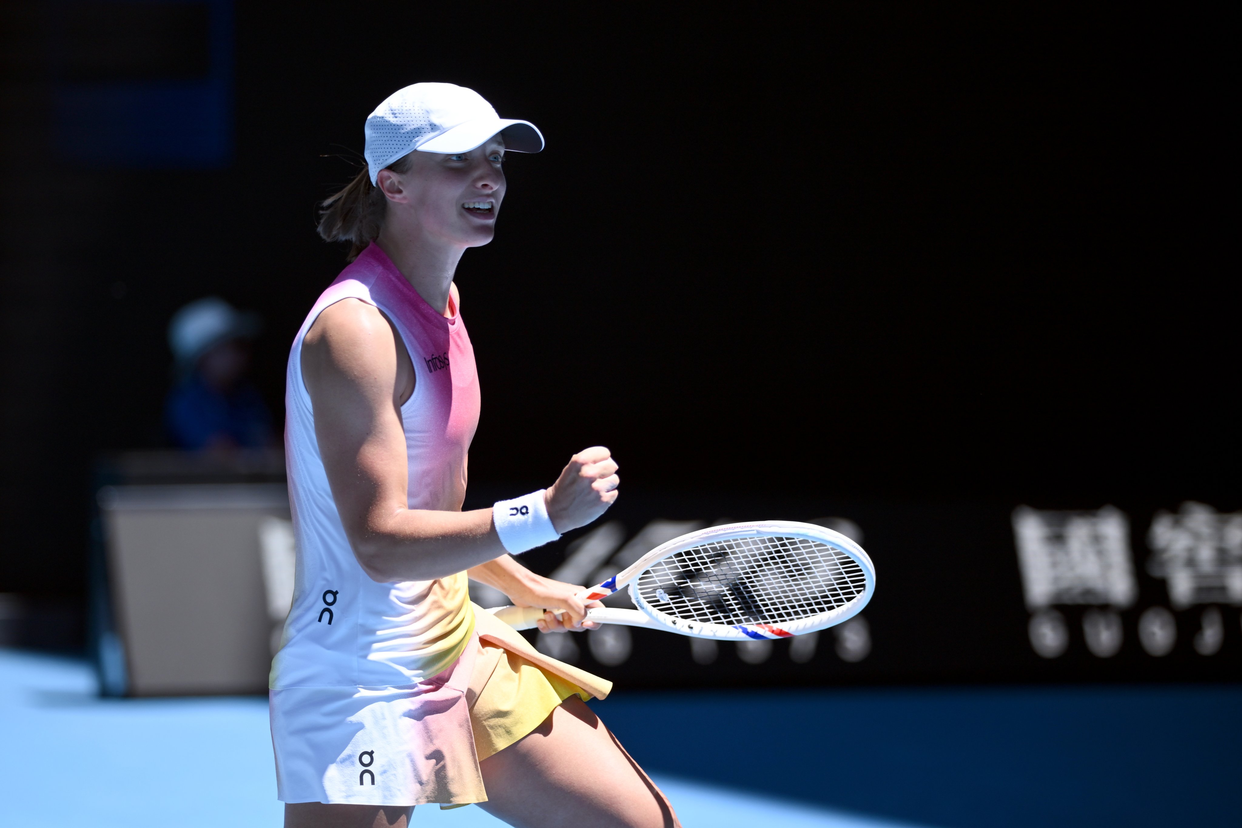 World No 2 Iga Swiatek celebrates match point during her round-three win over Emma Raducanu at the Australian Open. Photo: EPA