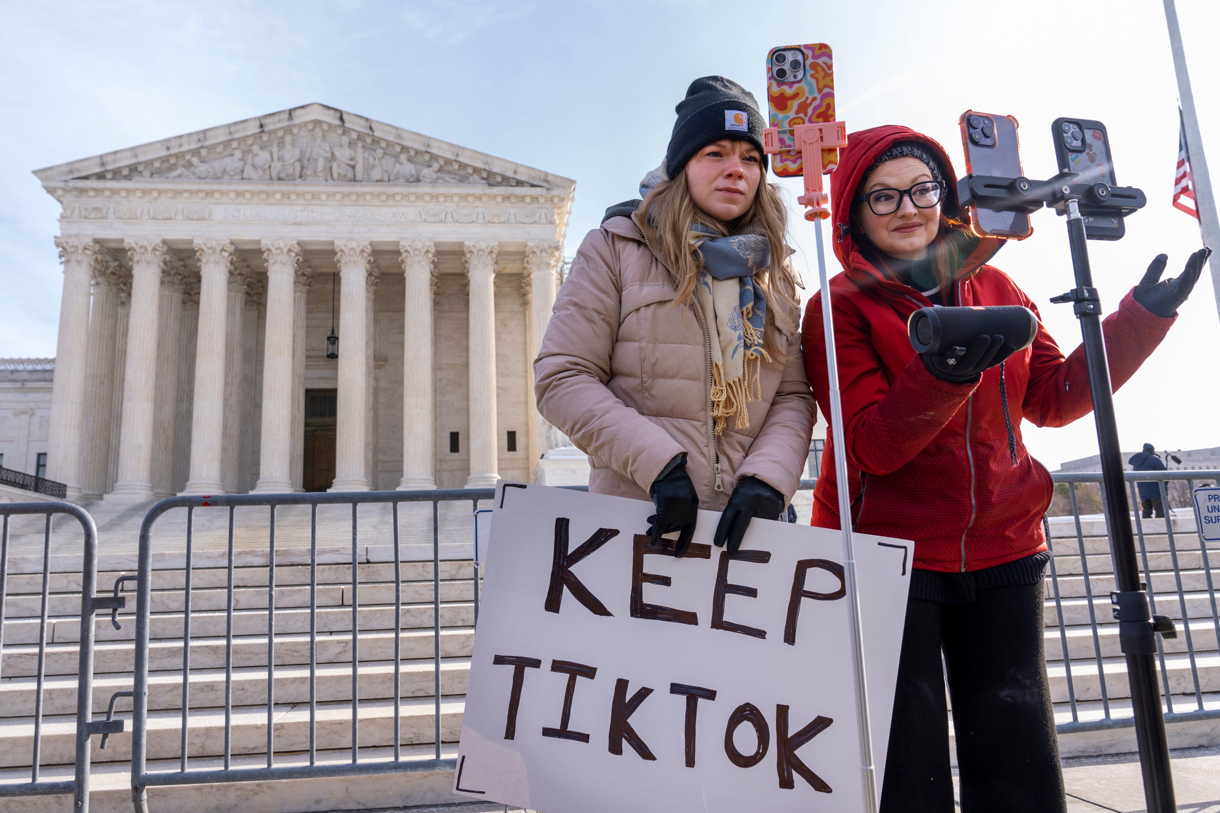 TikTok fans film themselves outside the US Supreme Court. Photo: AP 