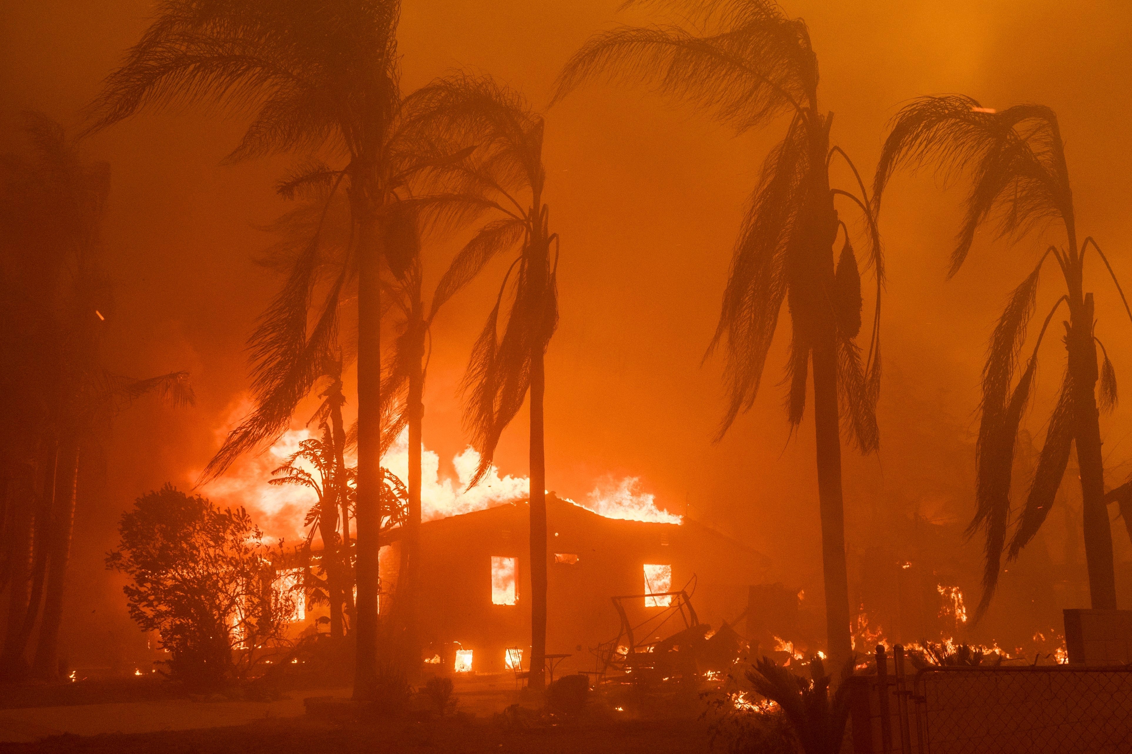 A home burns in the Eaton Fire in Altadena, Los Angeles County, California, on January 8, 2025, as fires continue to ravage parts of the city. Large swathes of Altadena have since been destroyed. Photo: AP