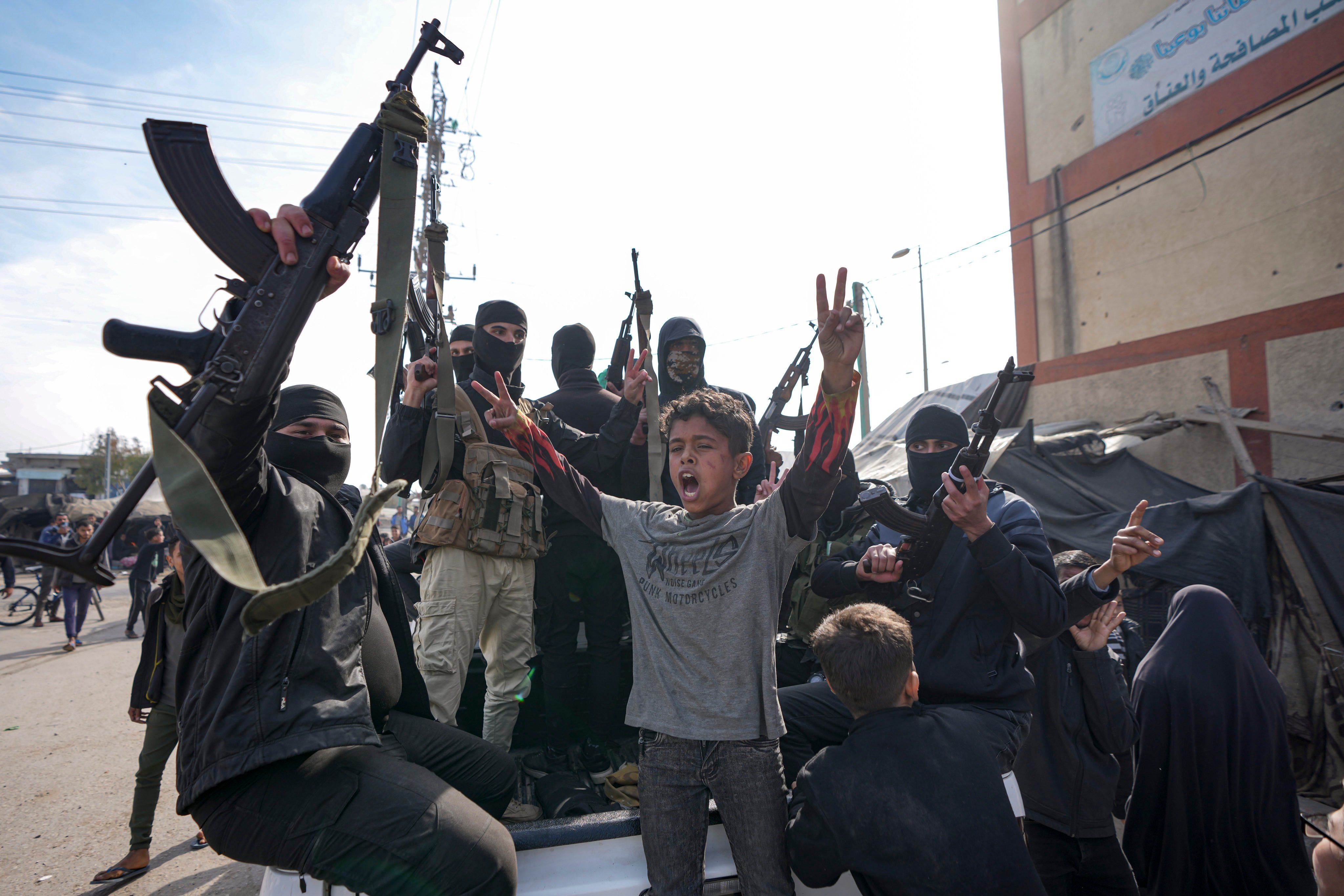 Members of the armed wing of the Palestinian group Hamas take part in a parade in Gaza as they celebrate a ceasefire agreement between Hamas and Israel on Sunday. Photo: AP