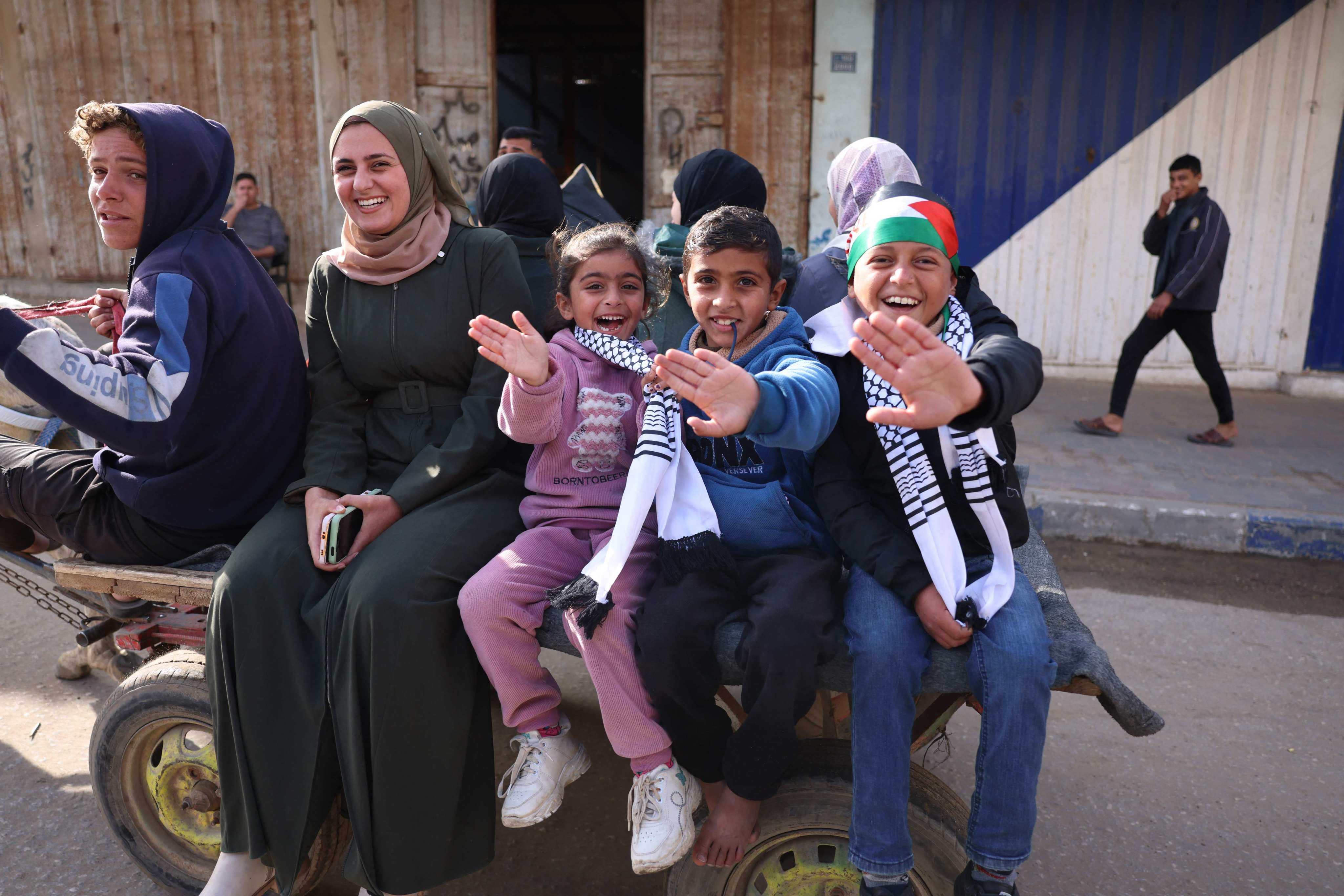 Children were among those cheering in the central Gaza Strip on Sunday, the day a long-awaited ceasefire between Israel and the Palestinian militant group Hamas was implemented. Photo: AFP