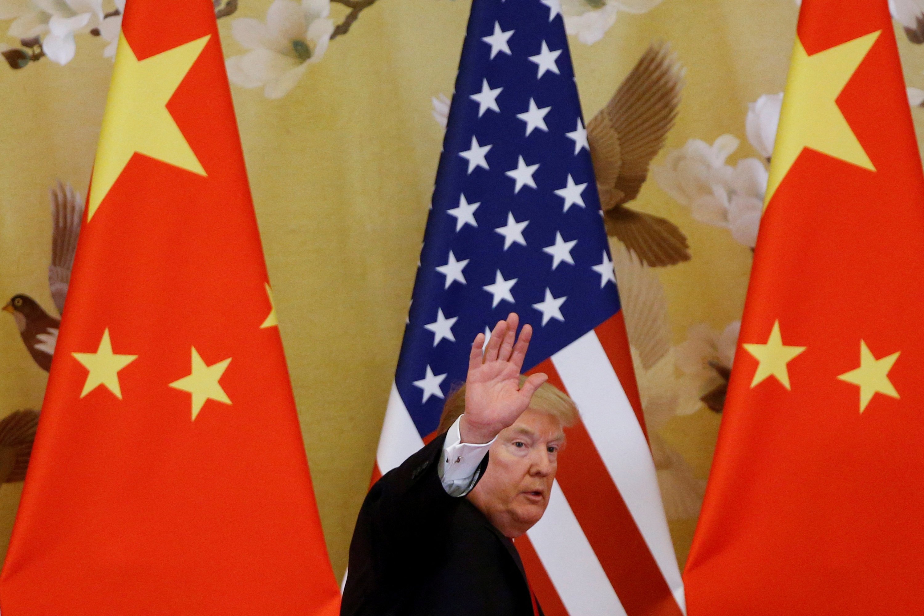 US President Donald Trump waves during a joint press event with China’s President Xi Jinping at the Great Hall of the People in Beijing in November 2017. Photo: Reuters