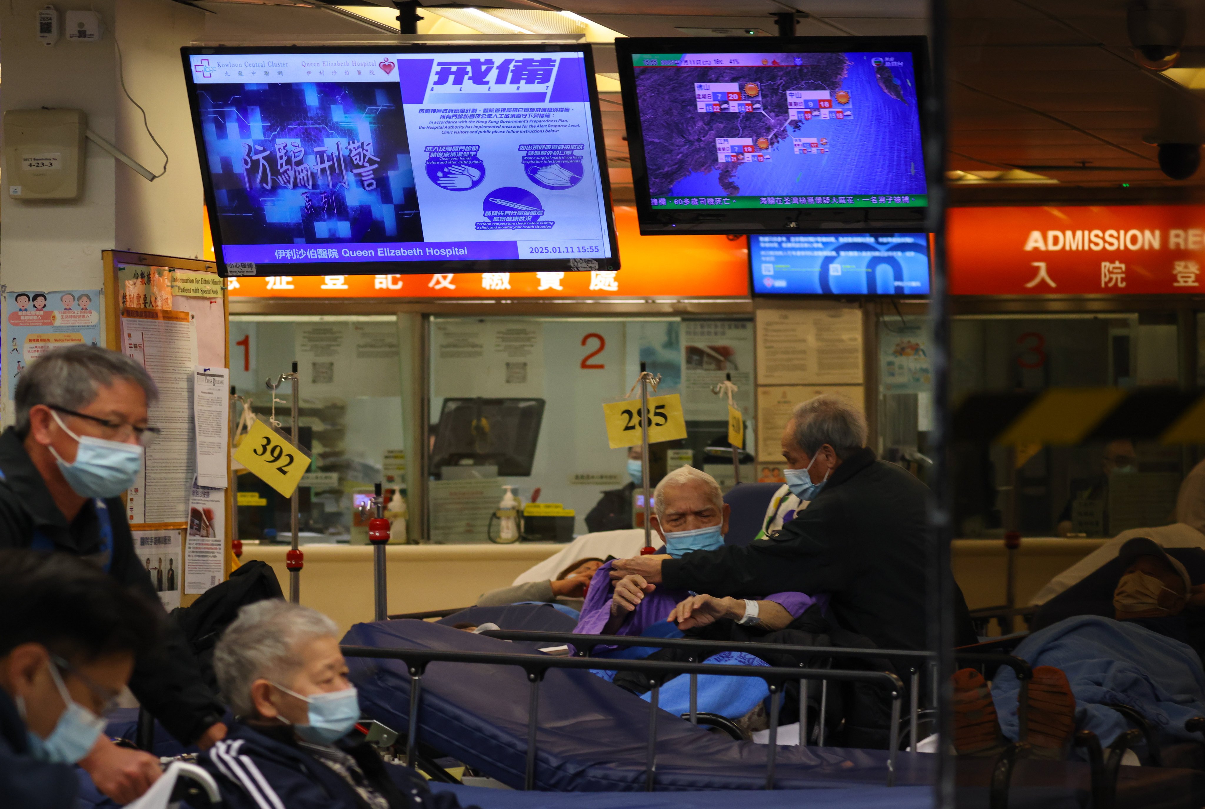 Screens showing a flu alert in the accident and emergency department at Queen Elizabeth Hospital in Yau Ma Tei. Photo: Nora Tam