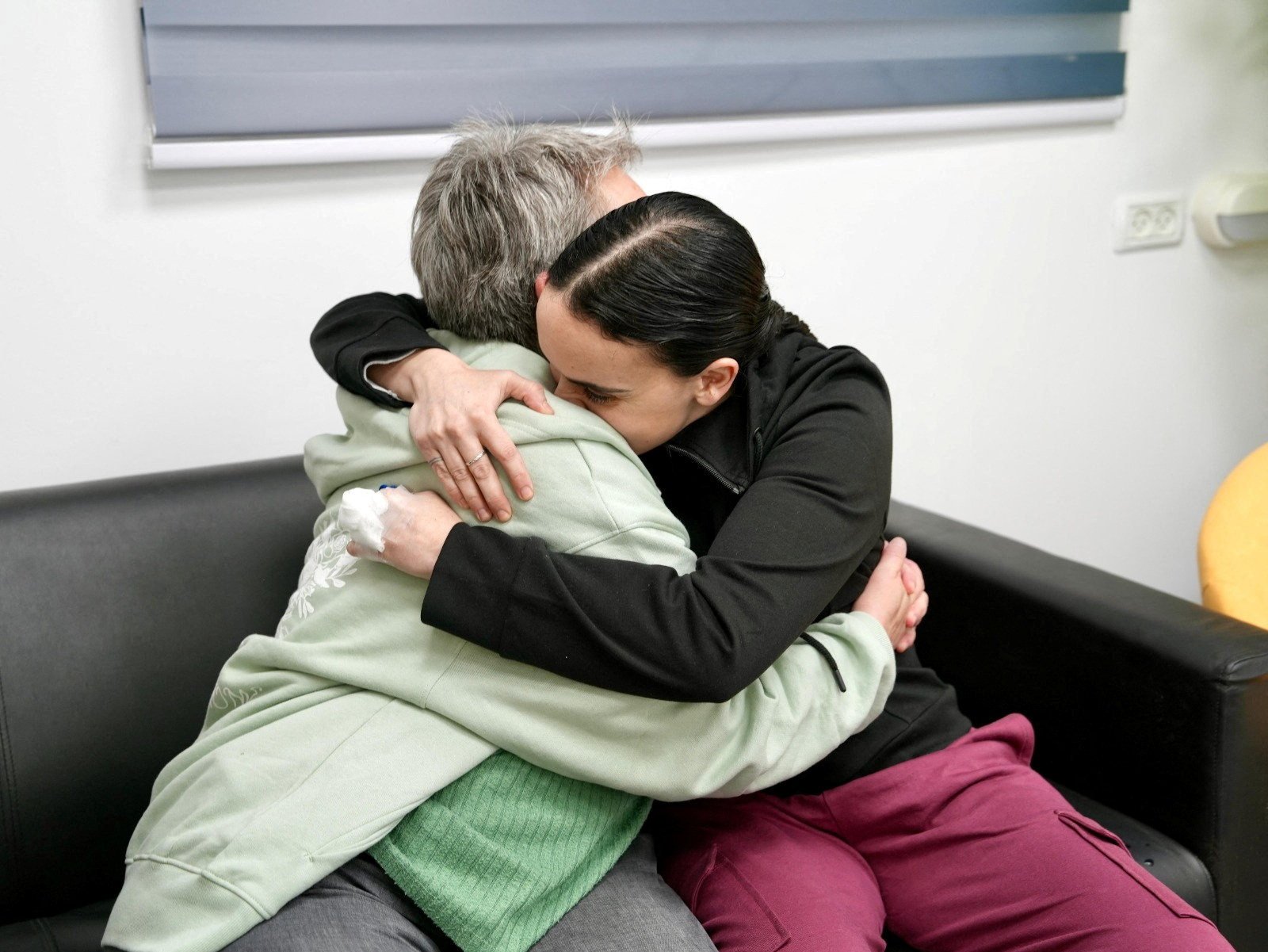 Released British-Israeli hostage Emily Damari embraces her mother, Mandy. Photo: Israel Defence Forces via Reuters