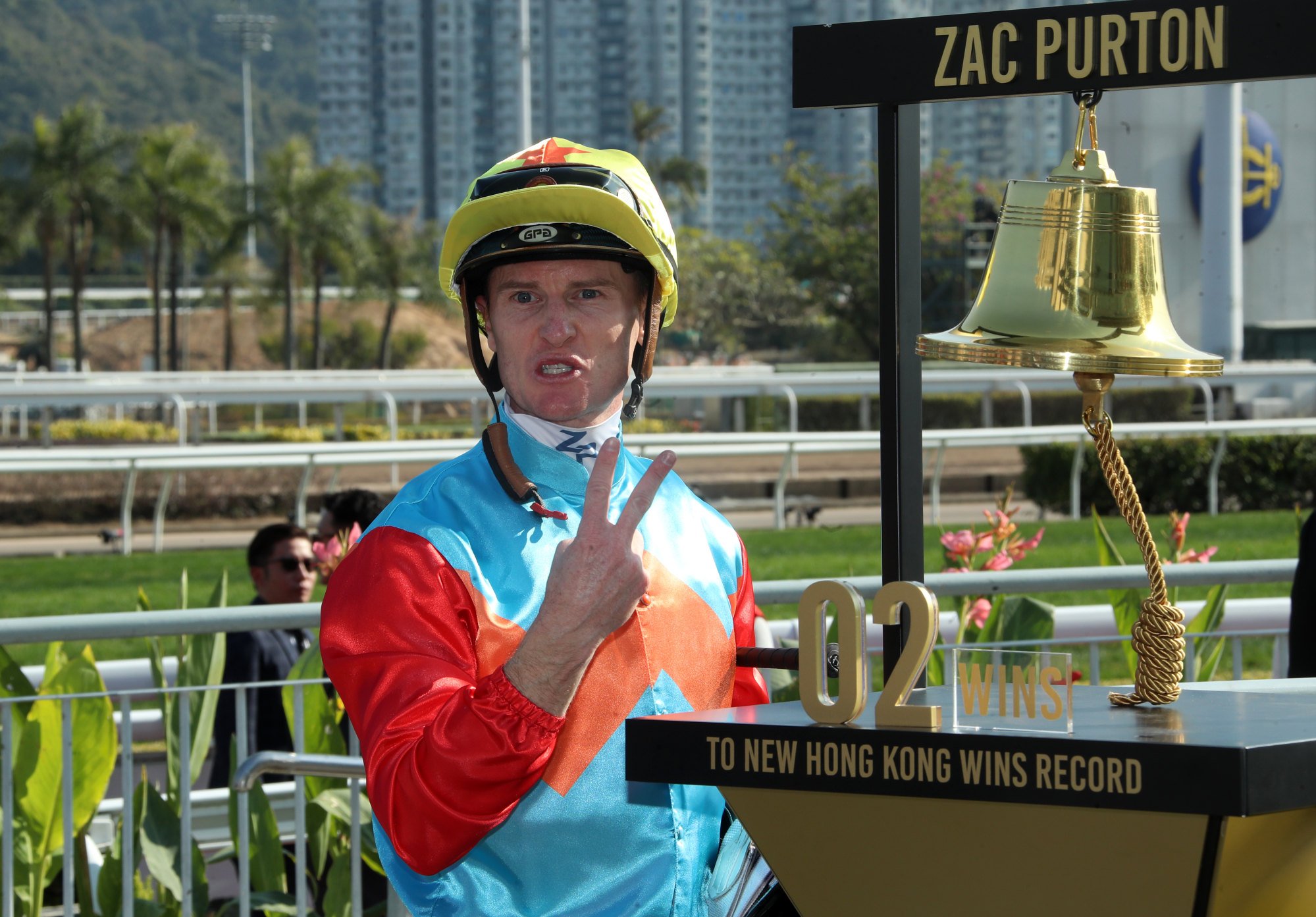 Zac Purton with the commemorative bell counting down his wins needed to break Douglas Whyte’s record.