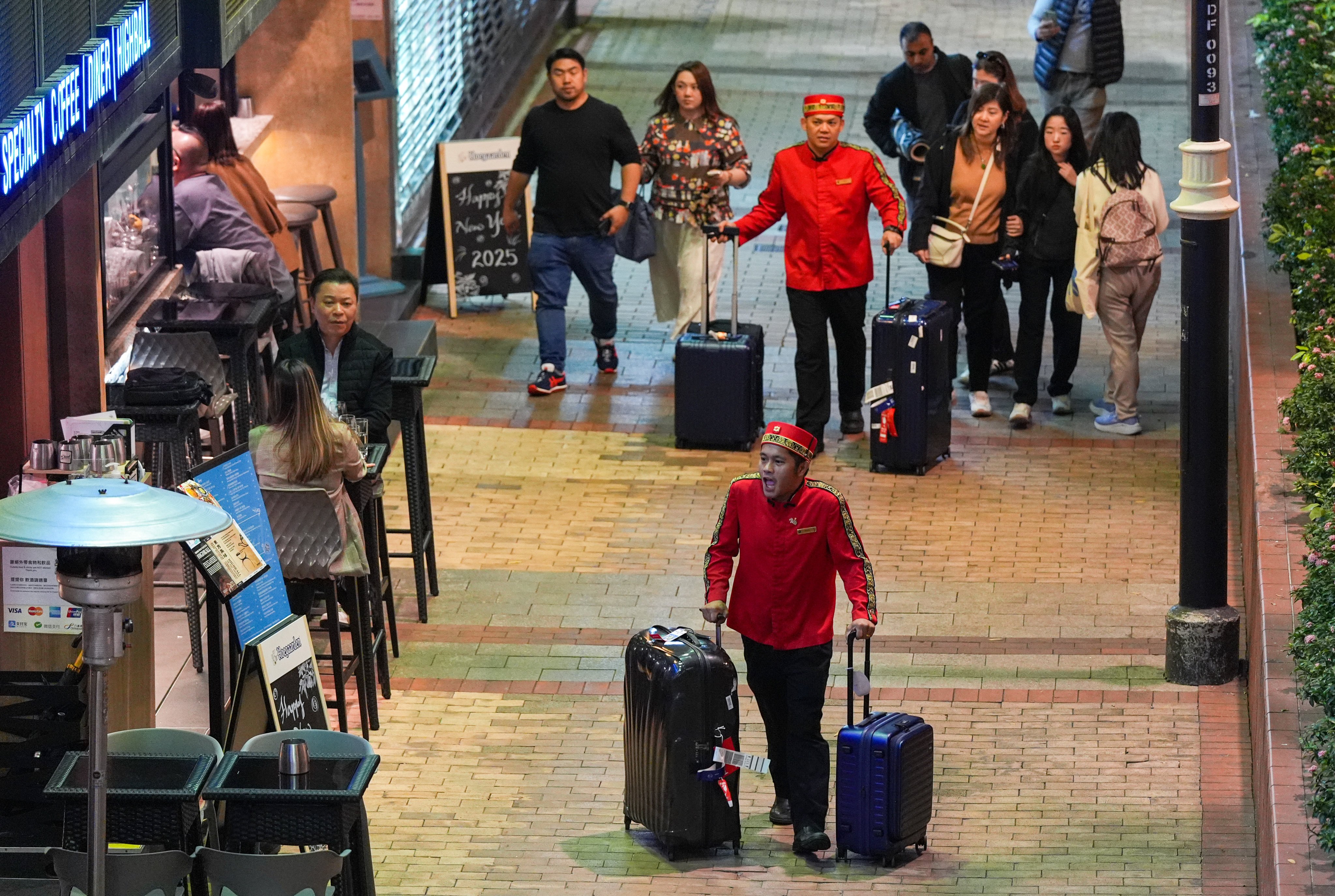 Hotel porters in Tsim Sha Tsui help guests with their luggages on December 31, 2024. Photo: Eugene Lee