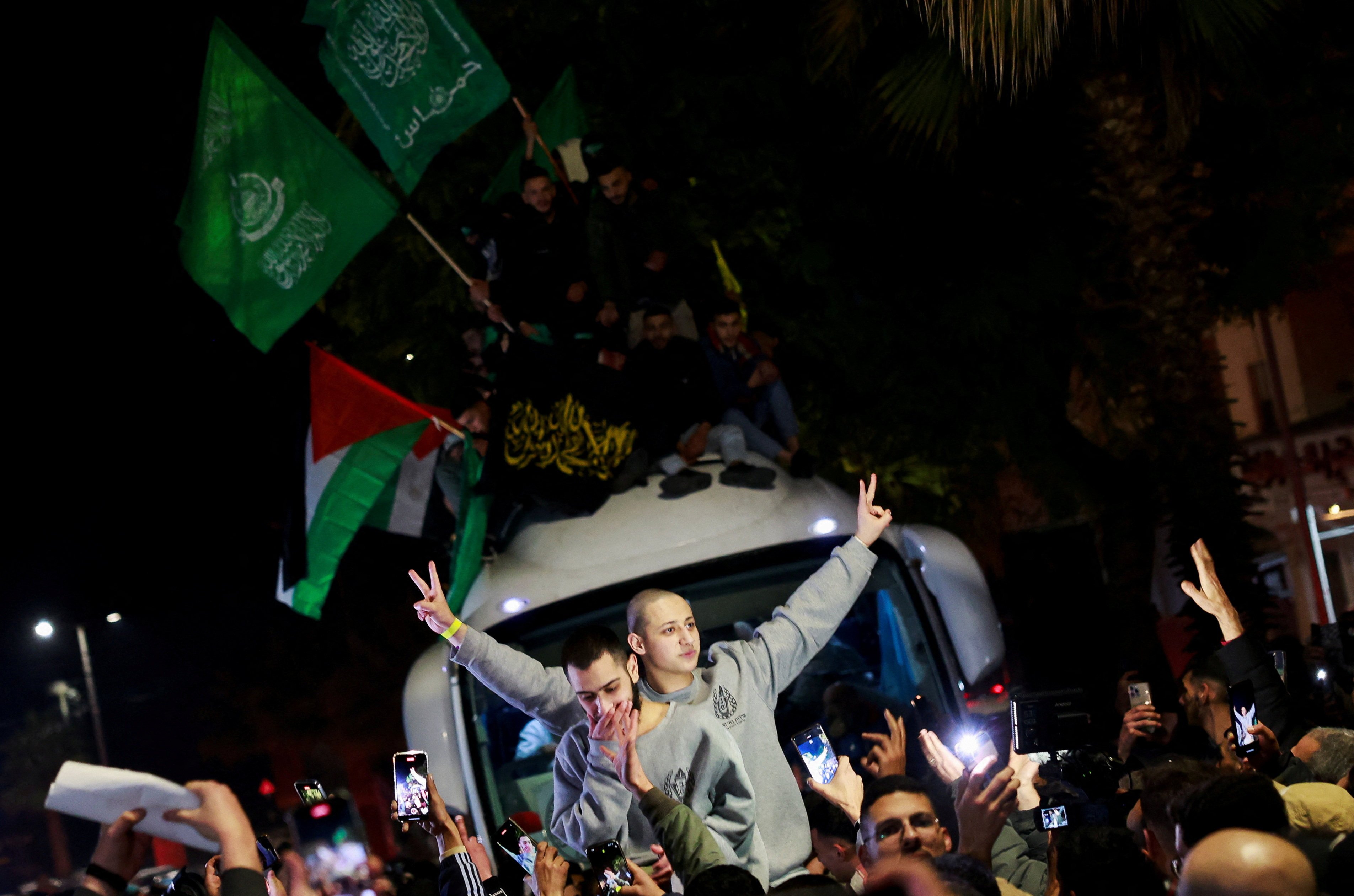 Scenes in Ramallah, in the Israeli-occupied West Bank, as freed Palestinians arrive by bus. Photo: Reuters