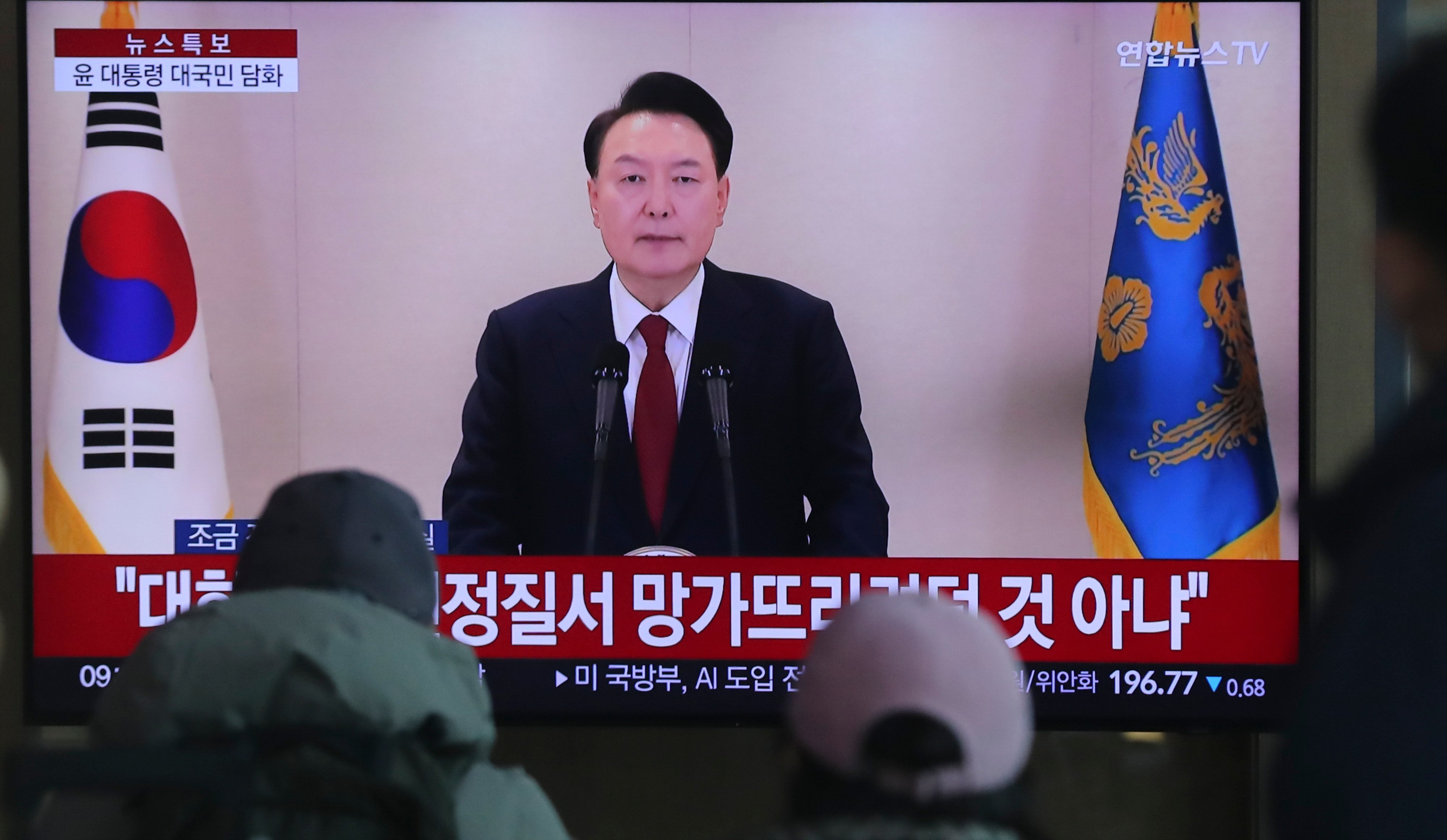 People watching a televised address by South Korean President Yoon Suk-yeol on December 12.  During the speech, Yoon accused North Korea of hacking the NEC and cast doubt on his party’s defeat in the 2024 National Assembly elections. Photo: Xinhua