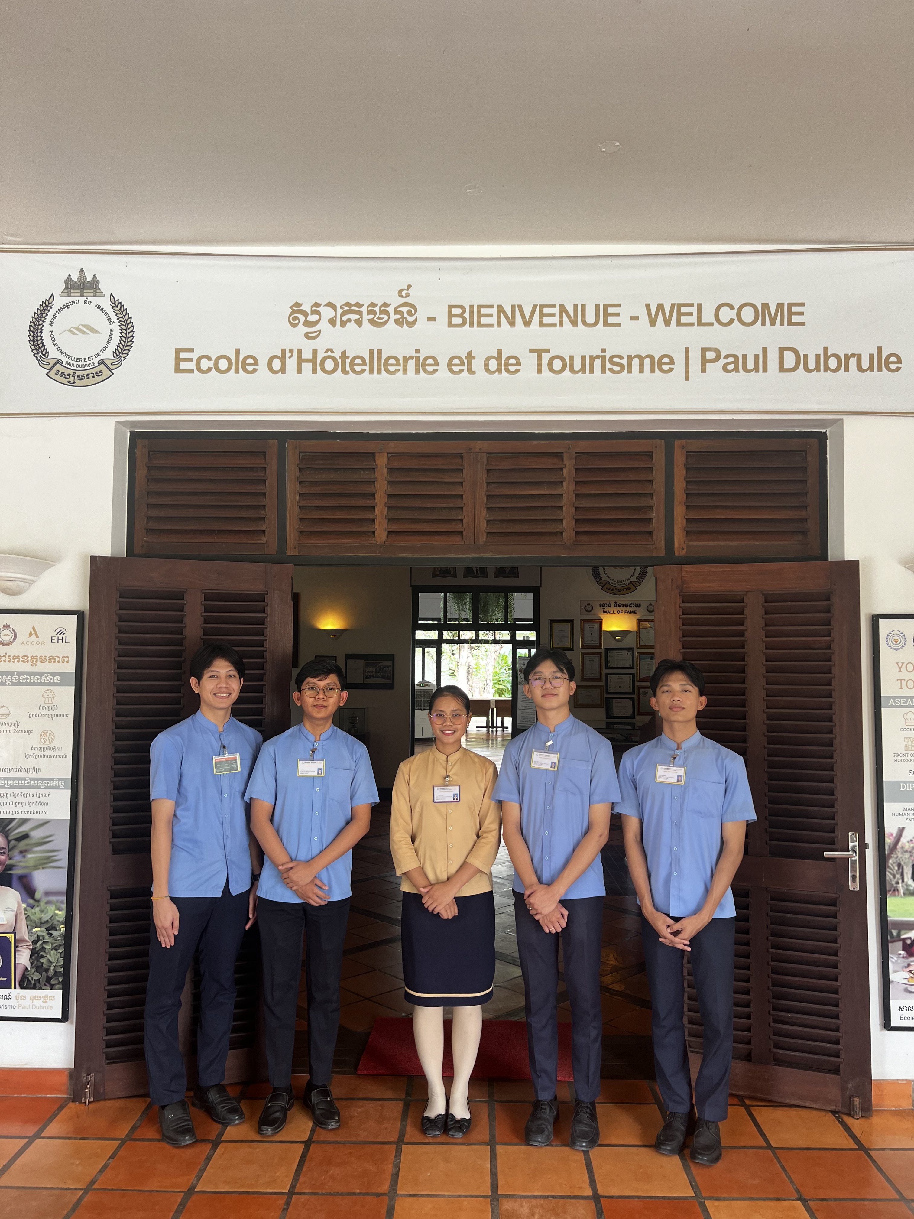 Hospitality students at the entrance to the École d’Hôtellerie et de Tourisme Paul Dubrule, opened in Siem Reap, Cambodia, 23 years ago by the Accor hotels group co-founder. Photo: Erika Na