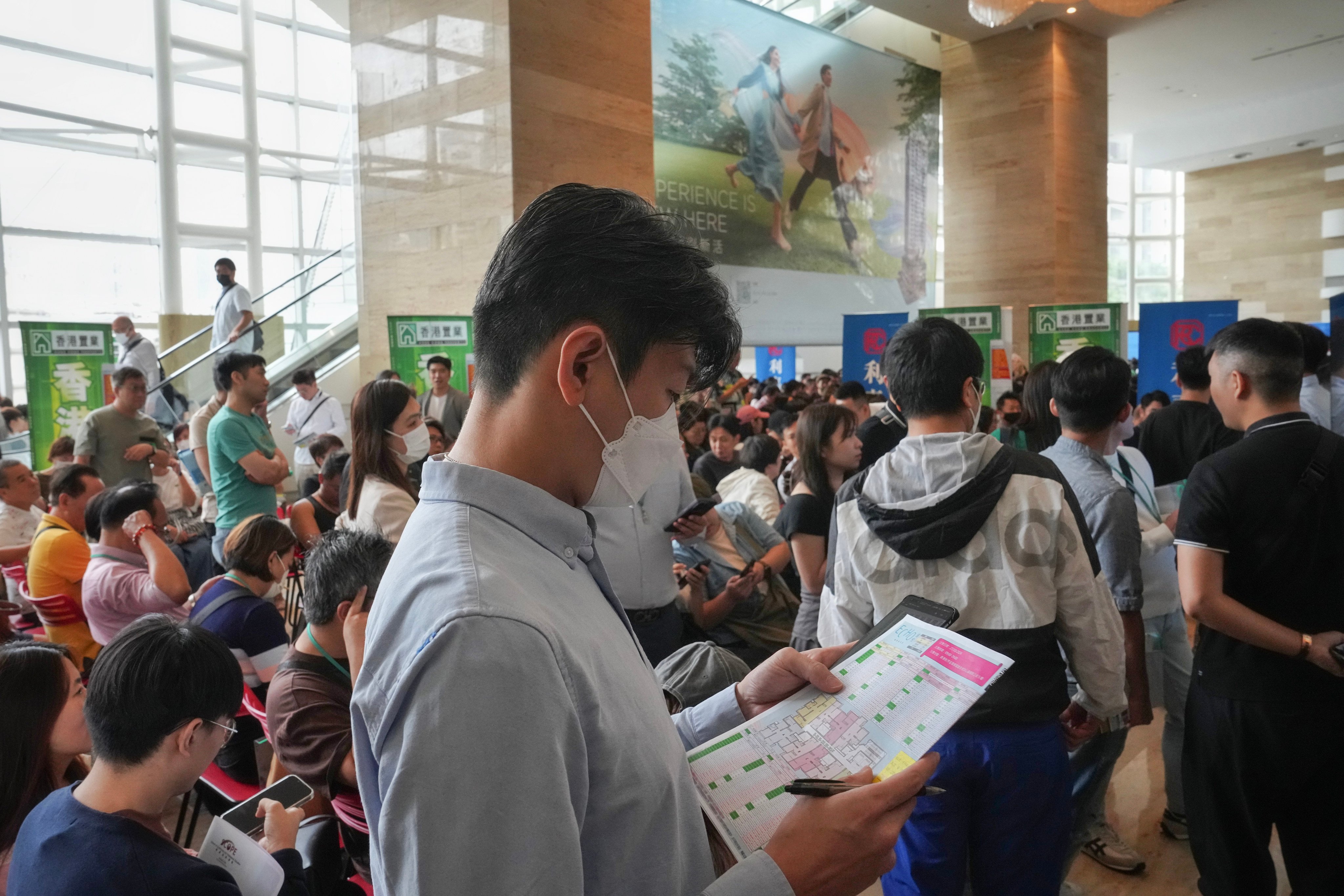 Property agents and buyers gather at a sales venue for 198 units of Chinachem’s Echo House on October 27, 2024. Photo: Elson Li